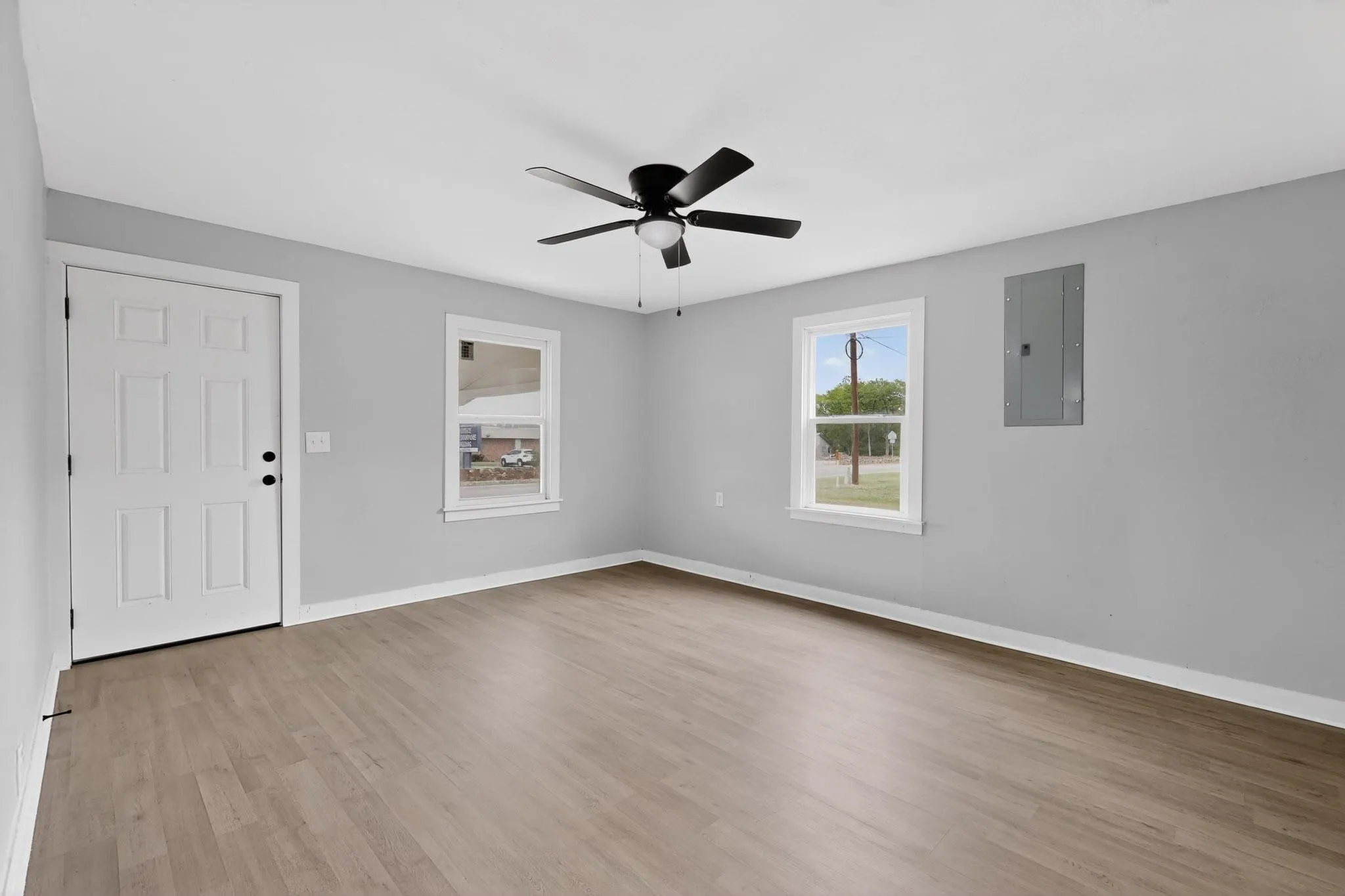Living room with a ceiling fan.