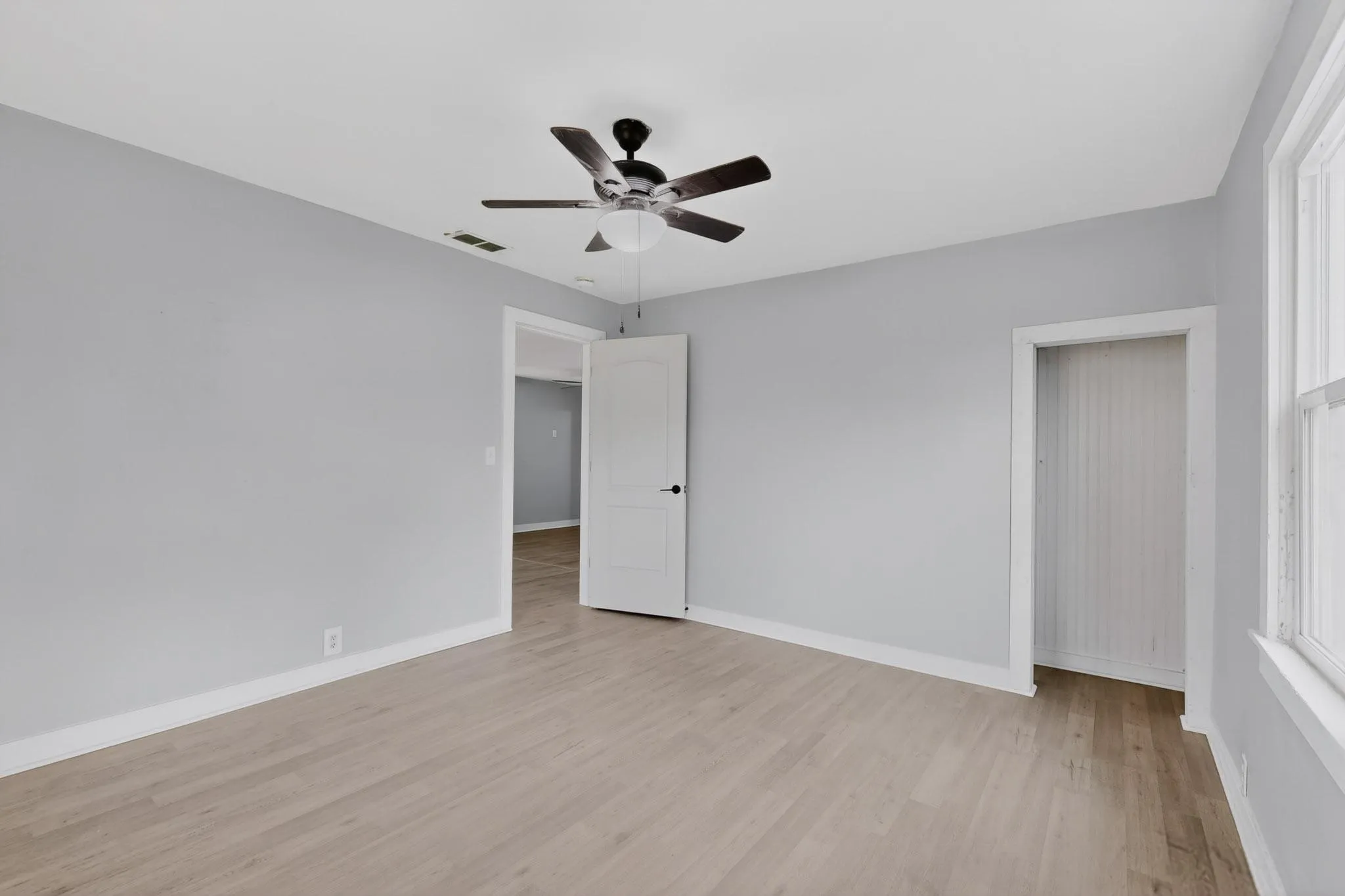 Another view of the primary bedroom