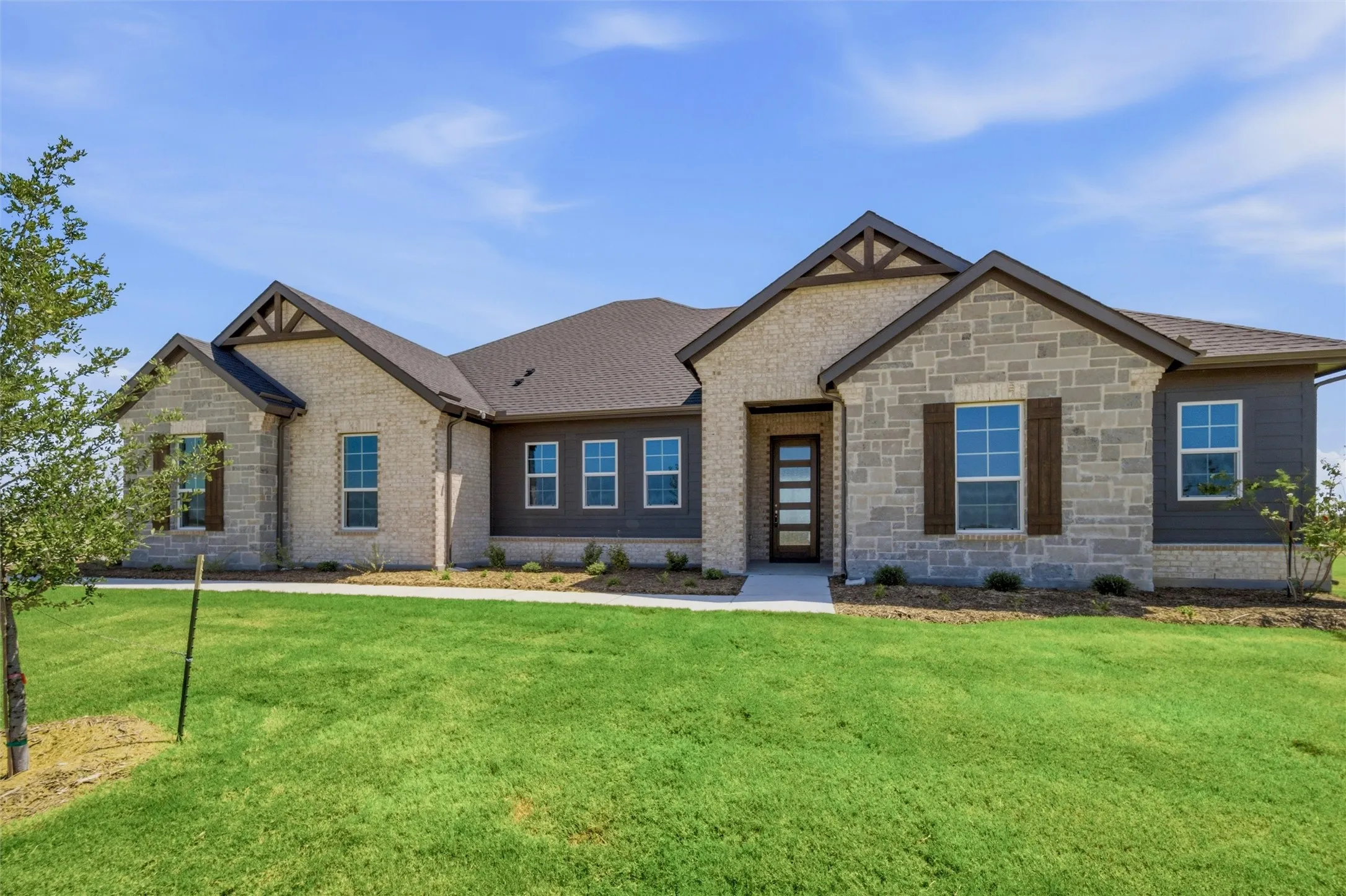 Stone and brick façade with wood accents