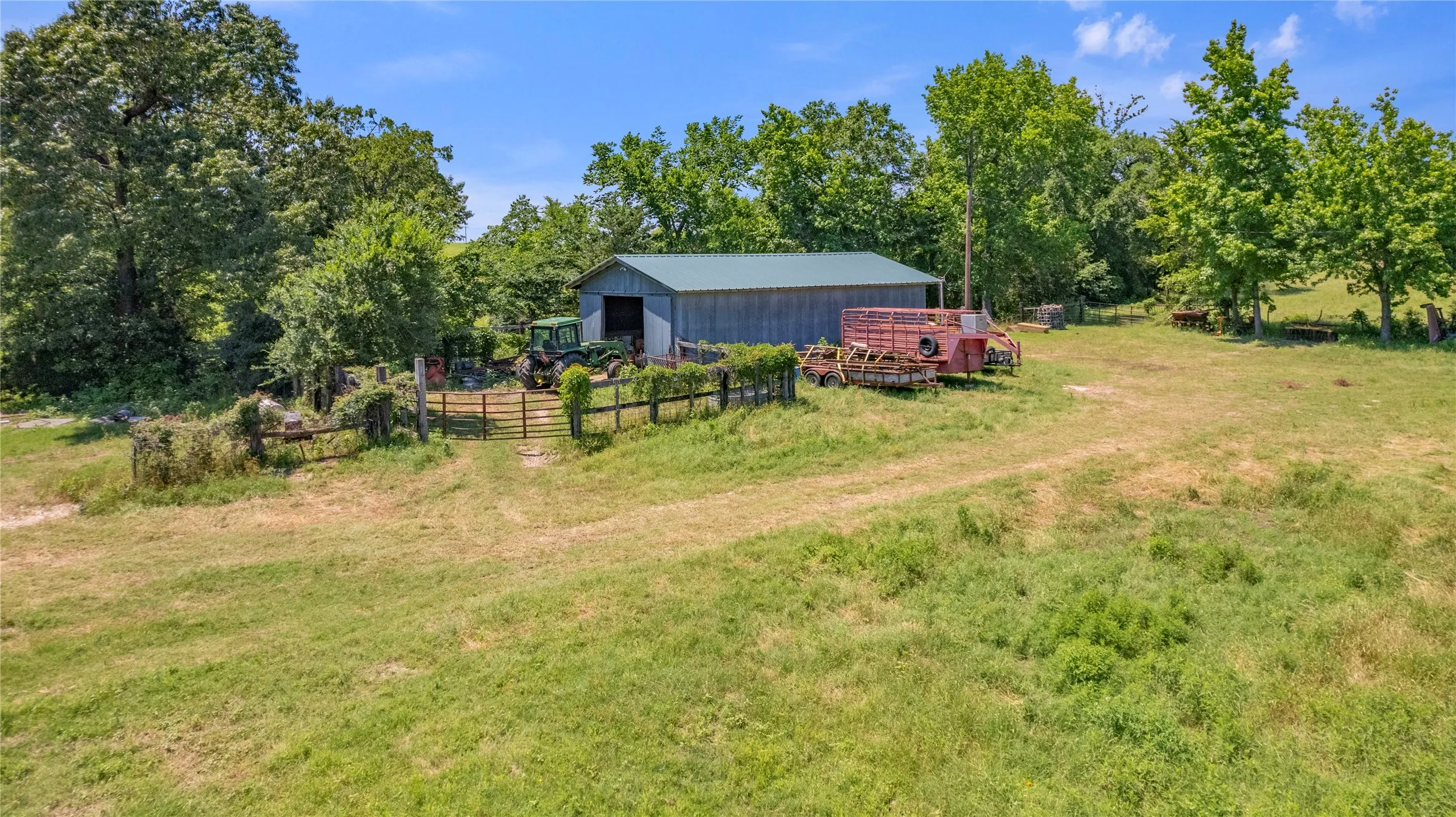 View of yard with a rural view and an outdoor structure