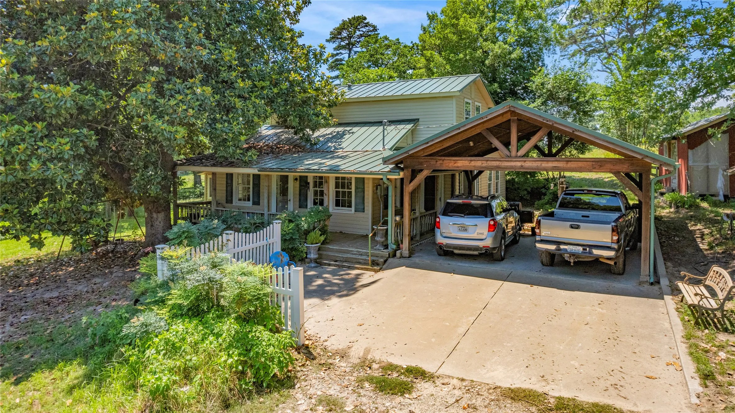 View of front facade with a carport and a porch