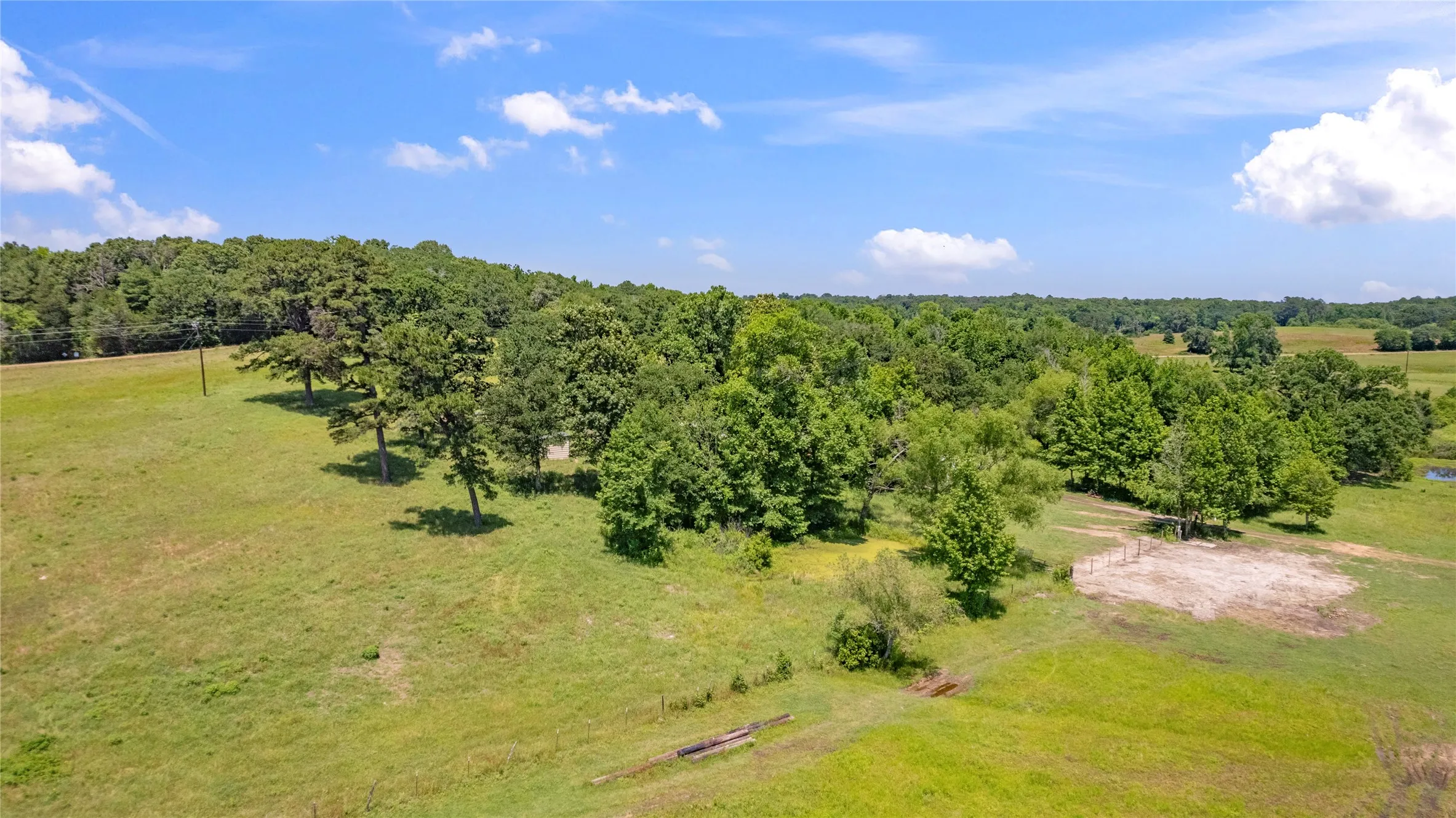 Birds eye view of property featuring a rural view
