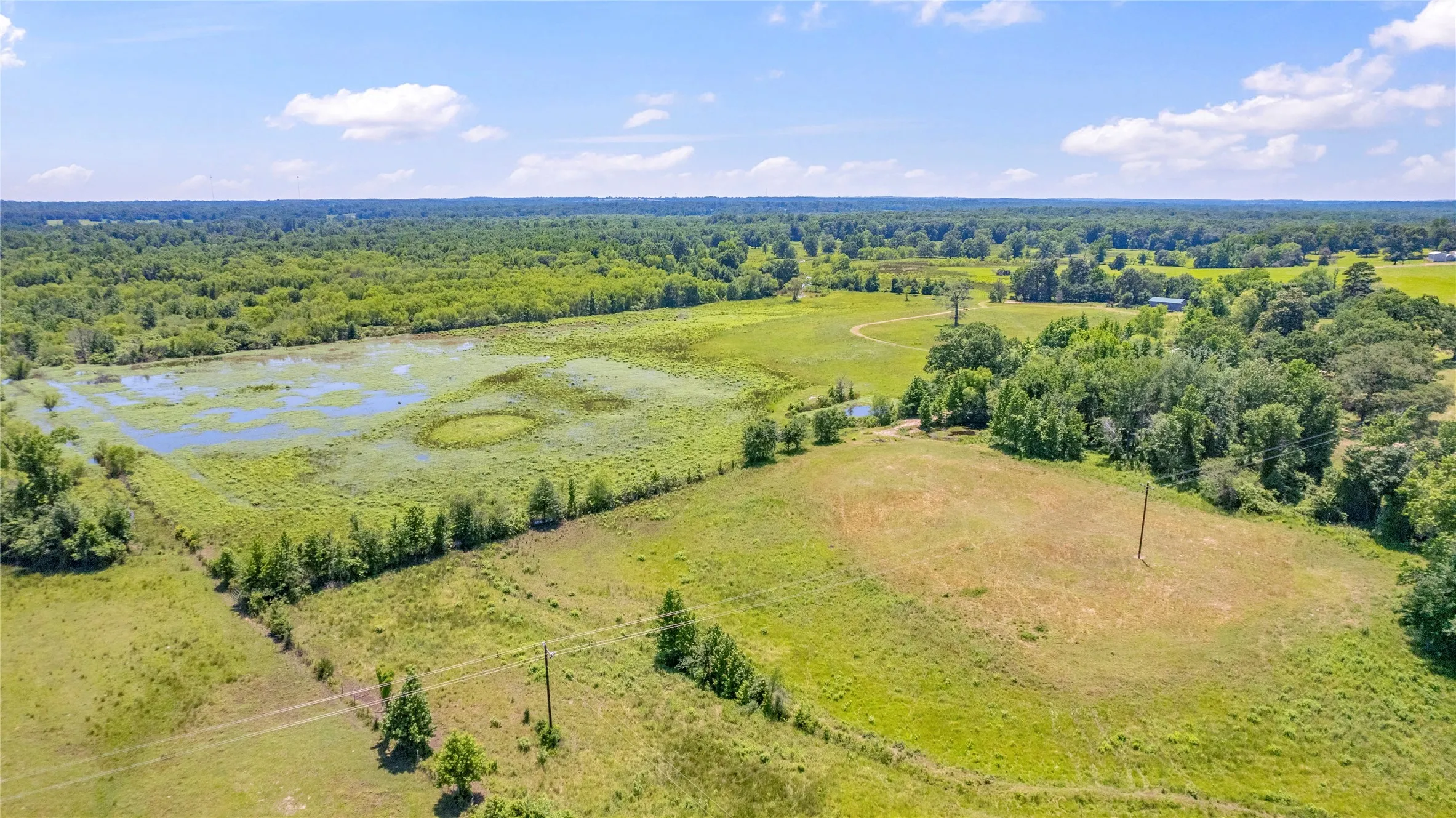 Aerial view featuring a rural view and a water view