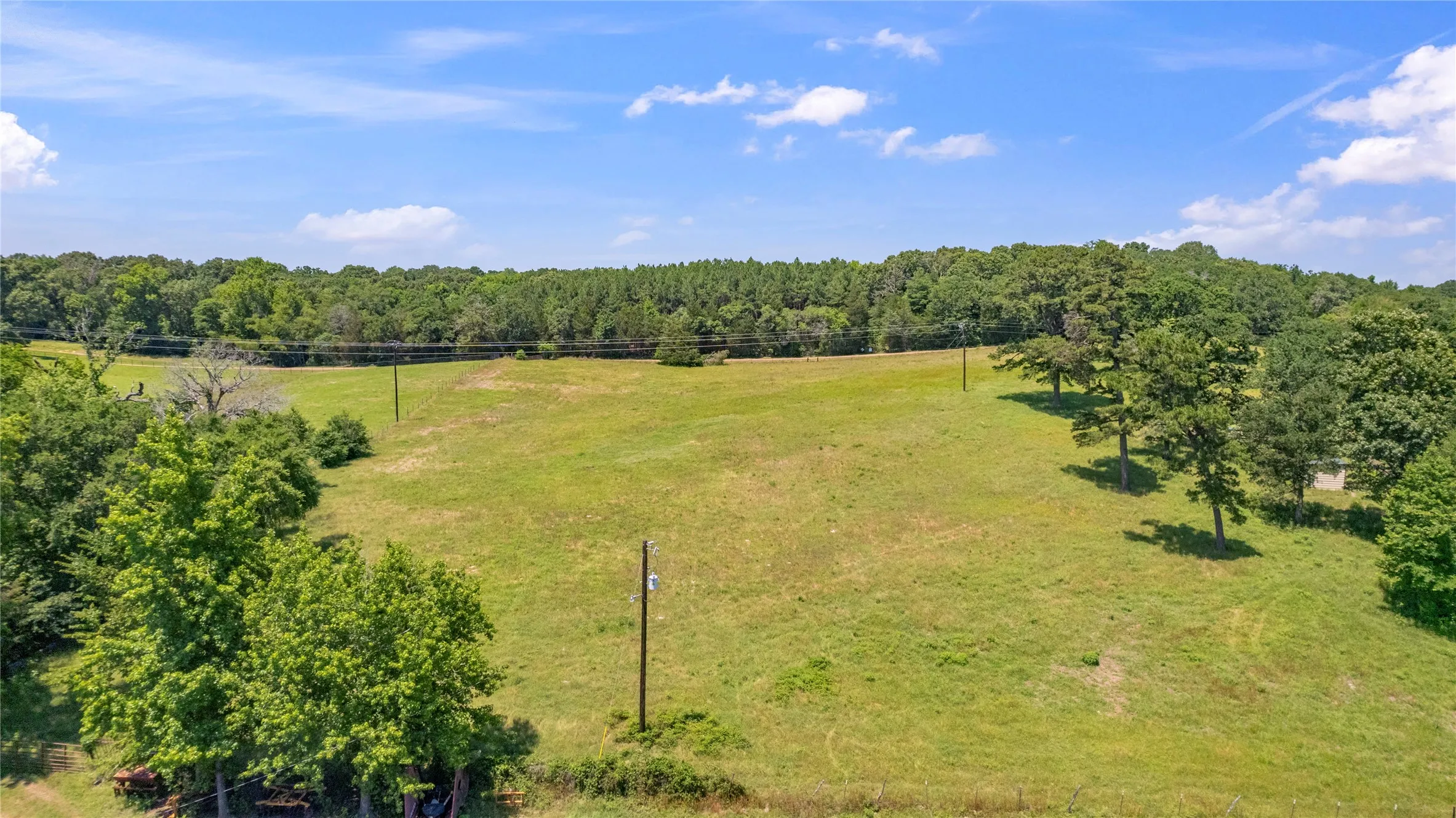 Birds eye view of property with a rural view