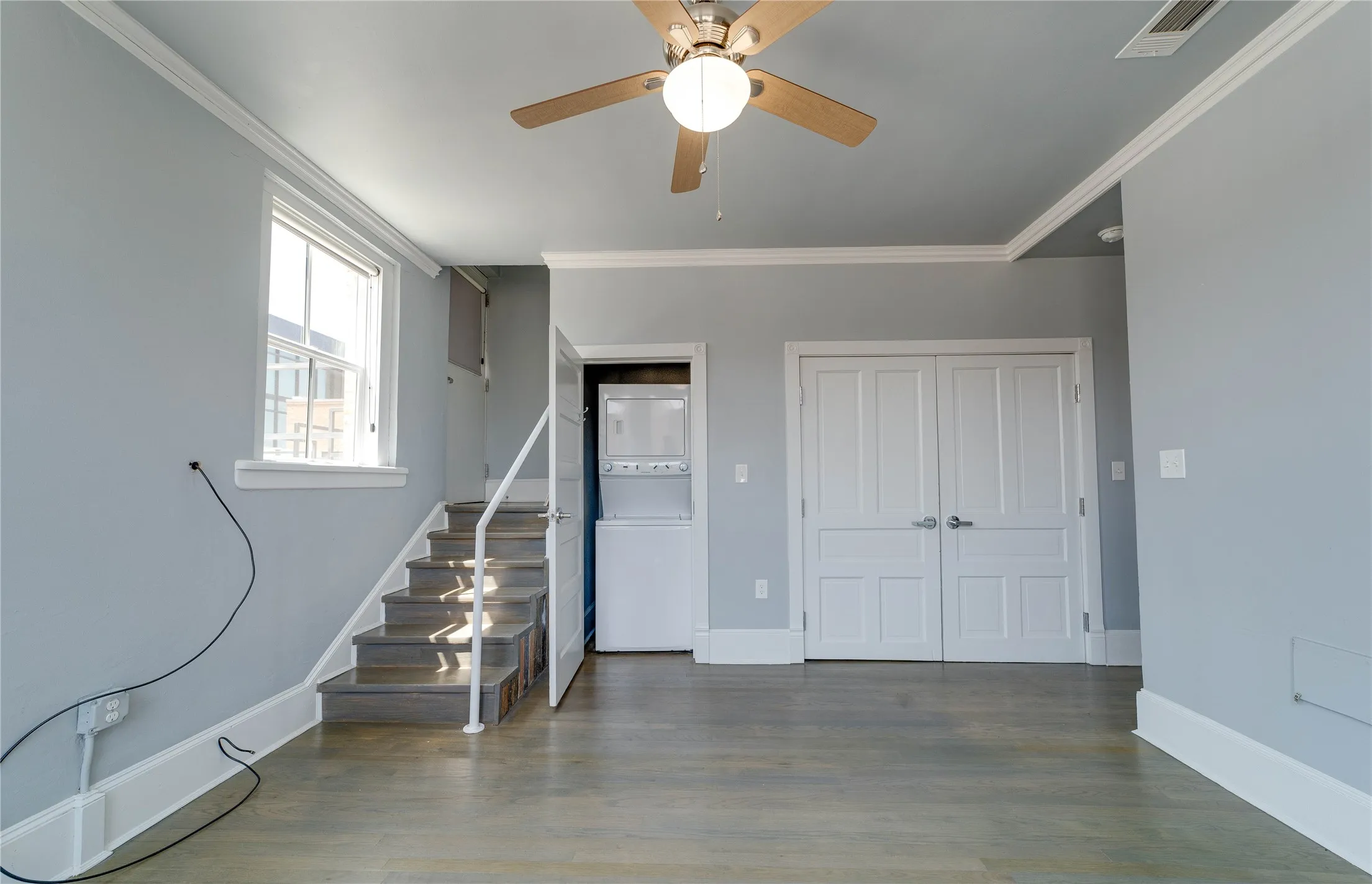 Steps to rooftop deck and stacked washer-dryer