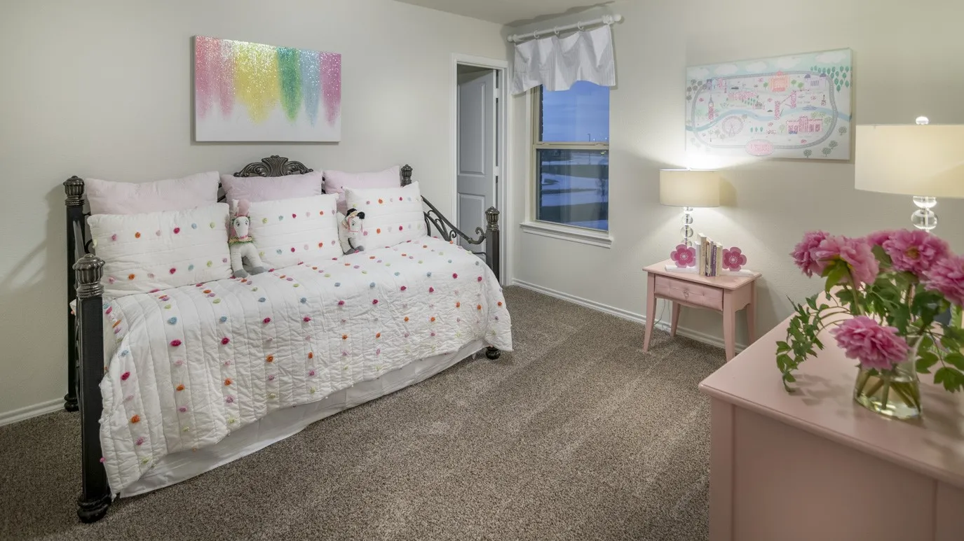 This room features comfortable carpeting, a well-lit window, and a charming bed frame