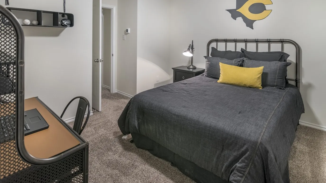 This room features neutral-toned walls and carpeted flooring
