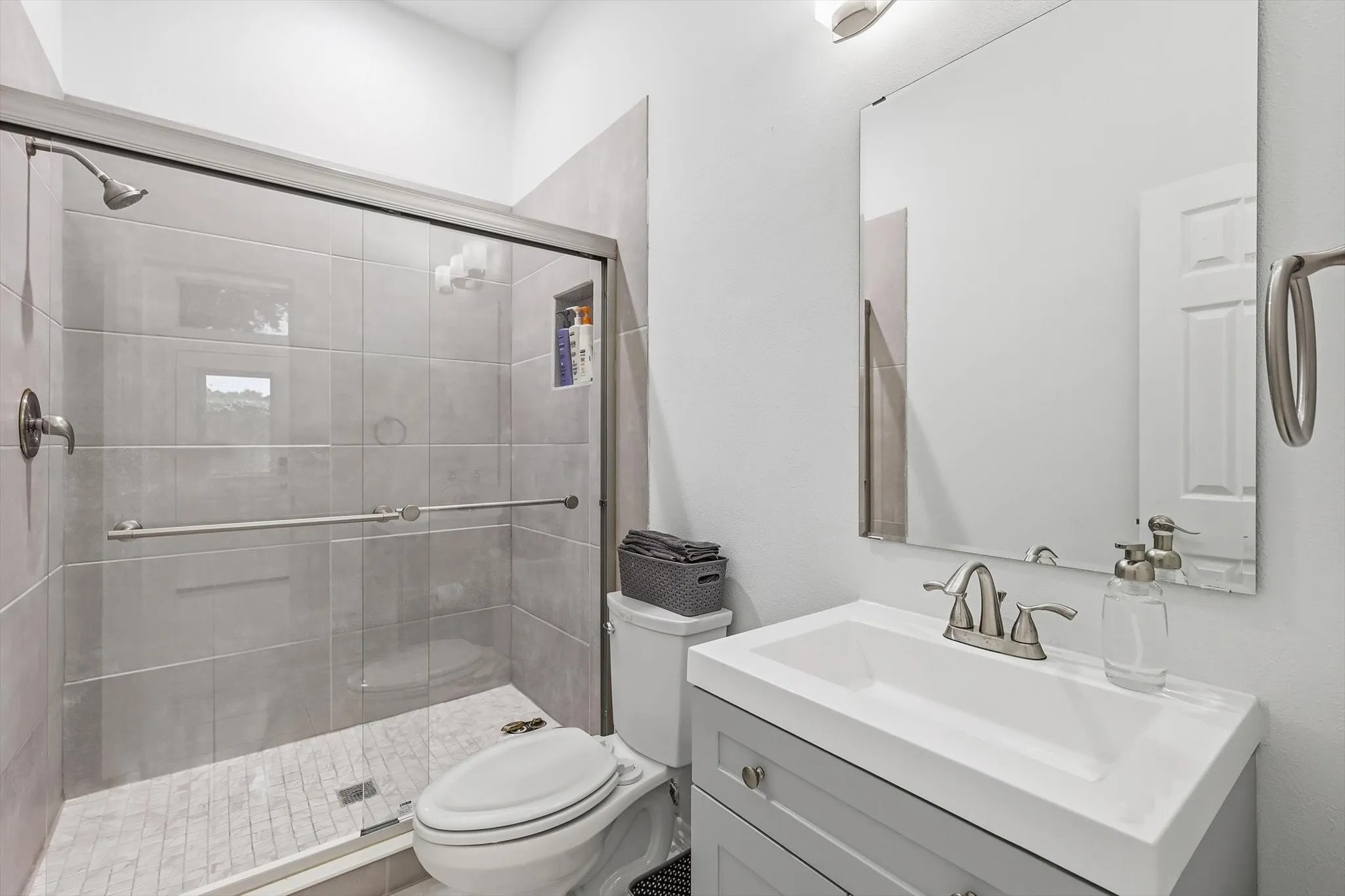 This bathroom is a full bath off the secondary downstairs bedroom.  This entire area can be closed off for either multigenerational living or a home business.