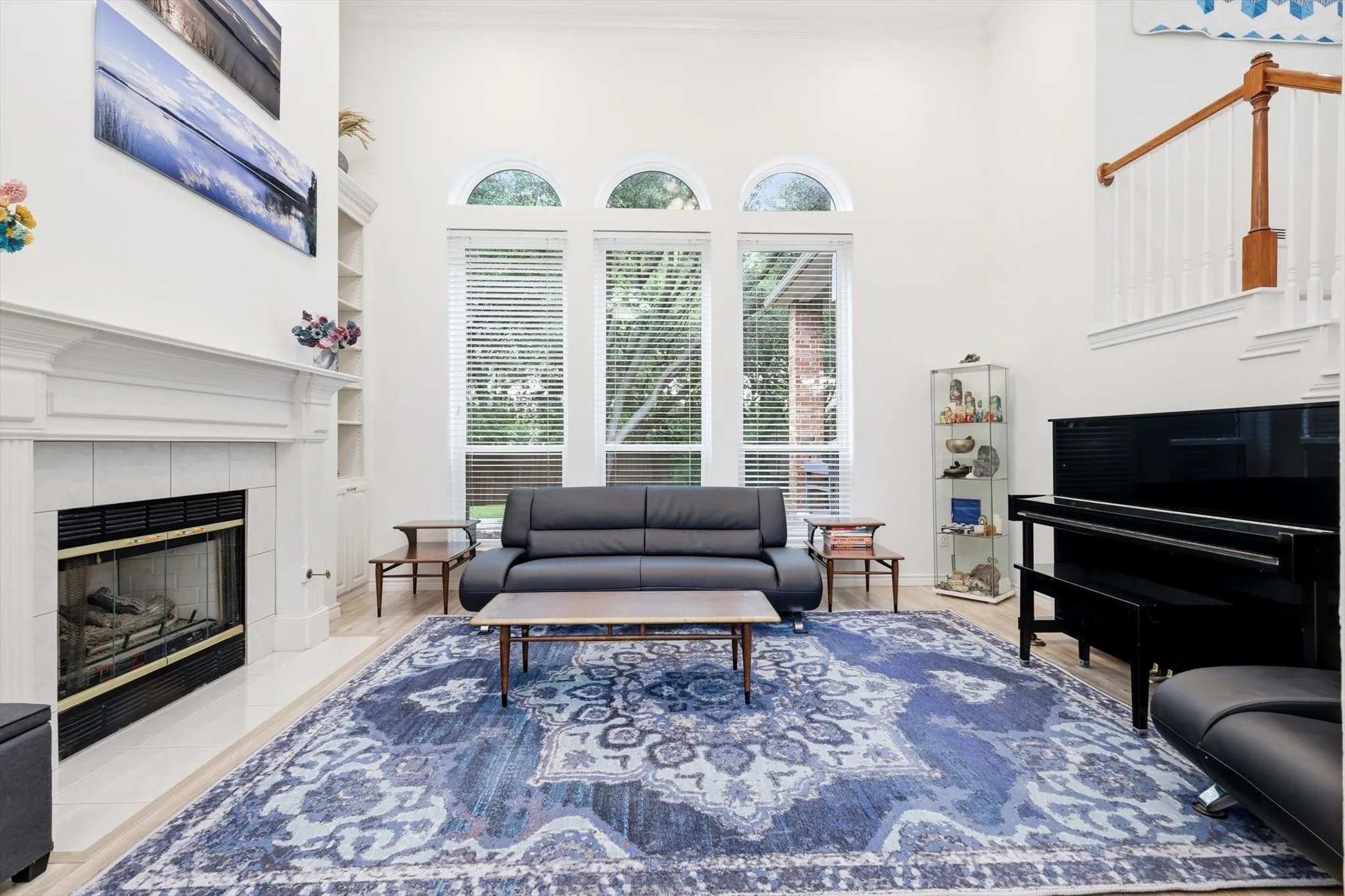 Open living with beautiful views of the spacious tree lined backyard