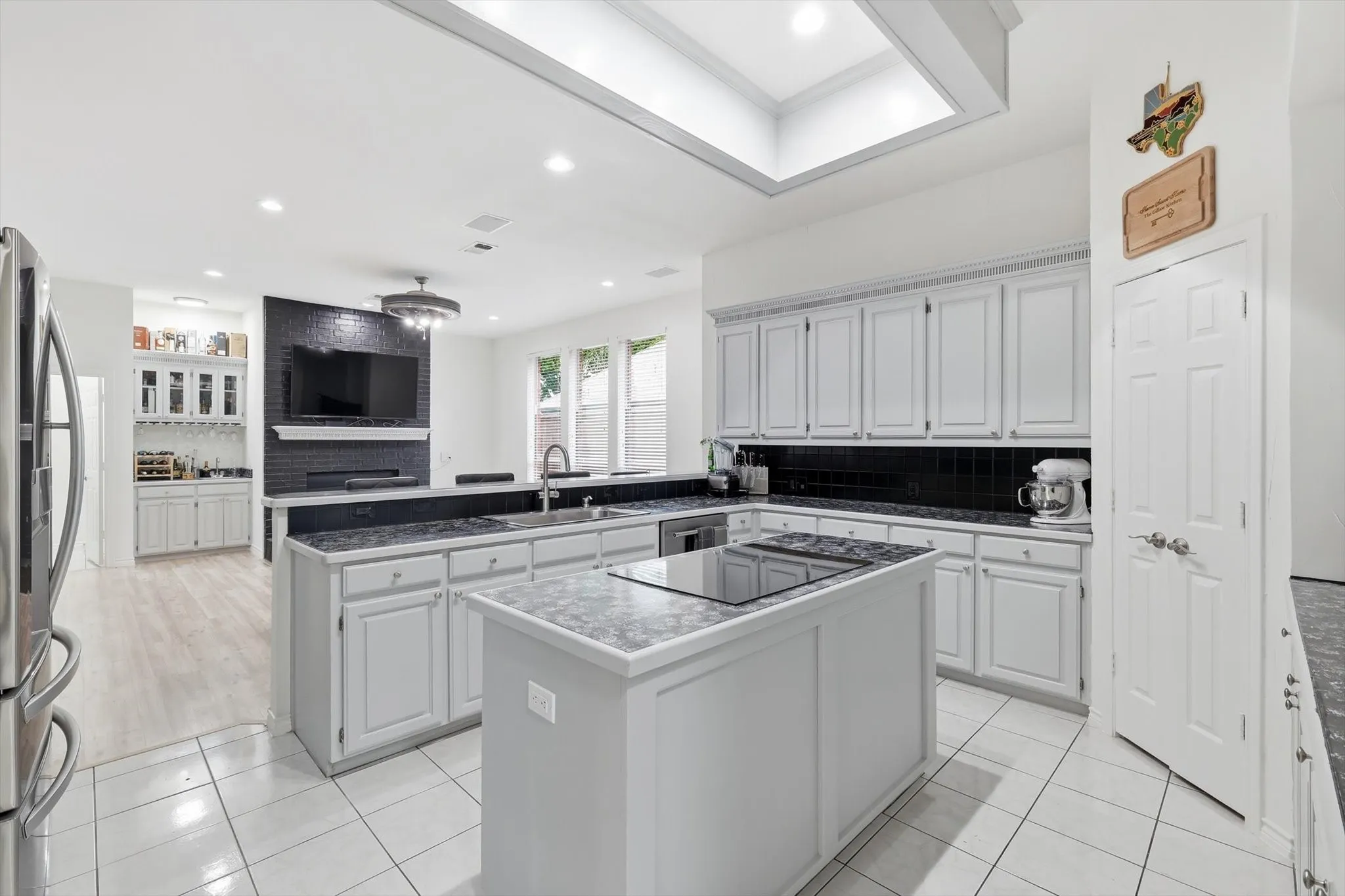 Induction cooktop in center island allows for easy use of island both for cooking and for entertaining.