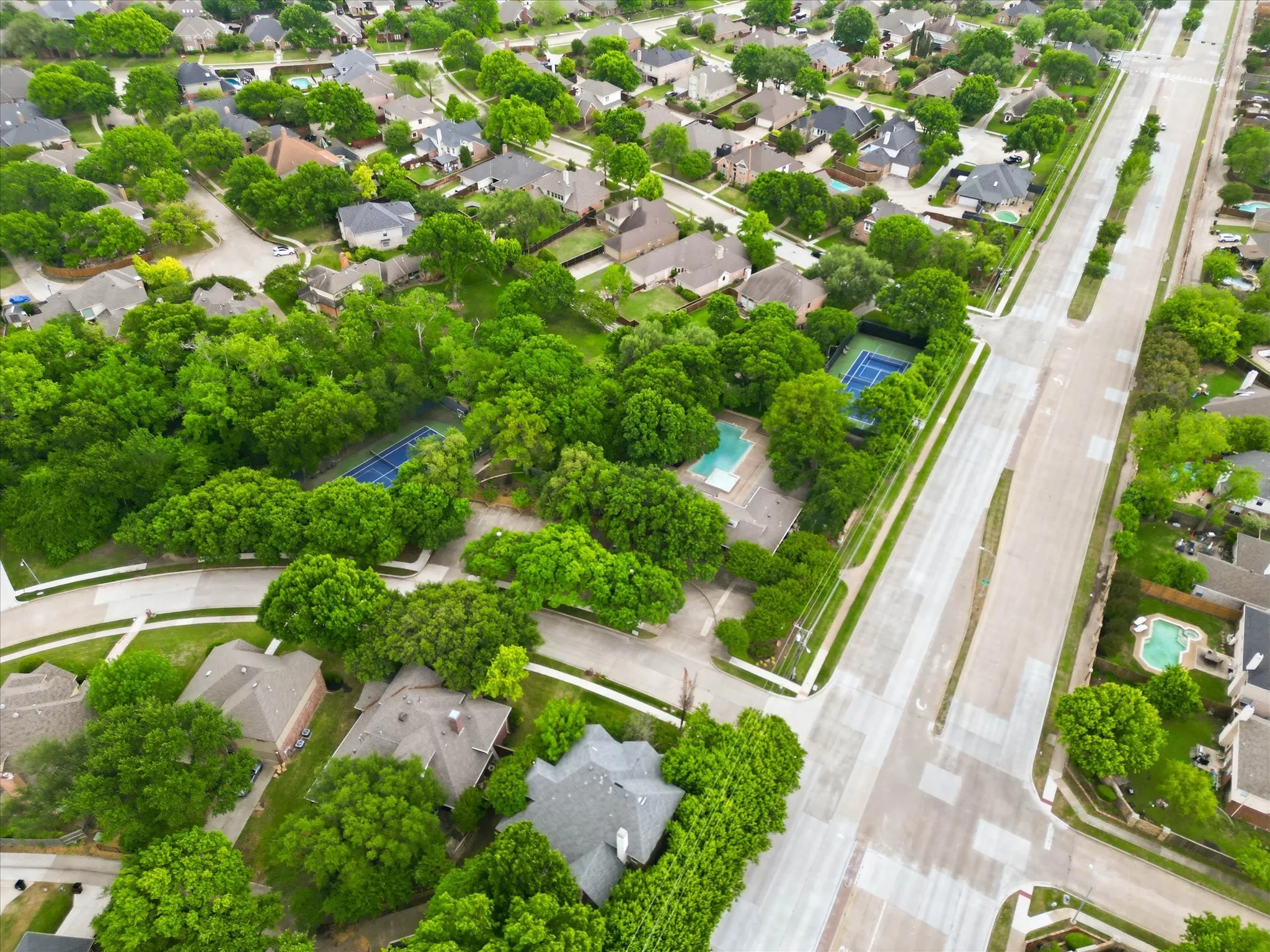 View of the tennis courts, pickleball courts and community pool in the neighborhood
