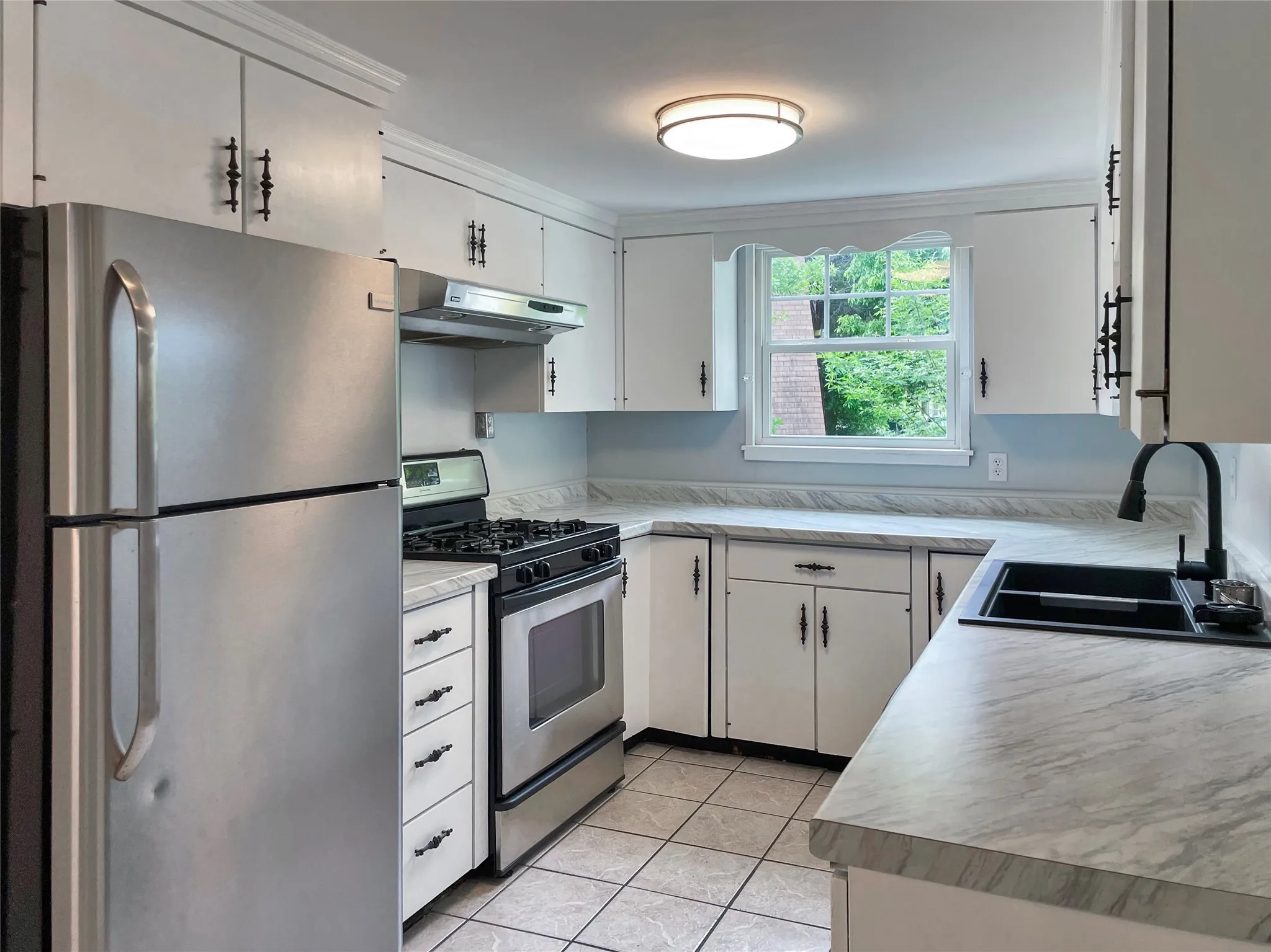 Feature countertops, sink, and paint.