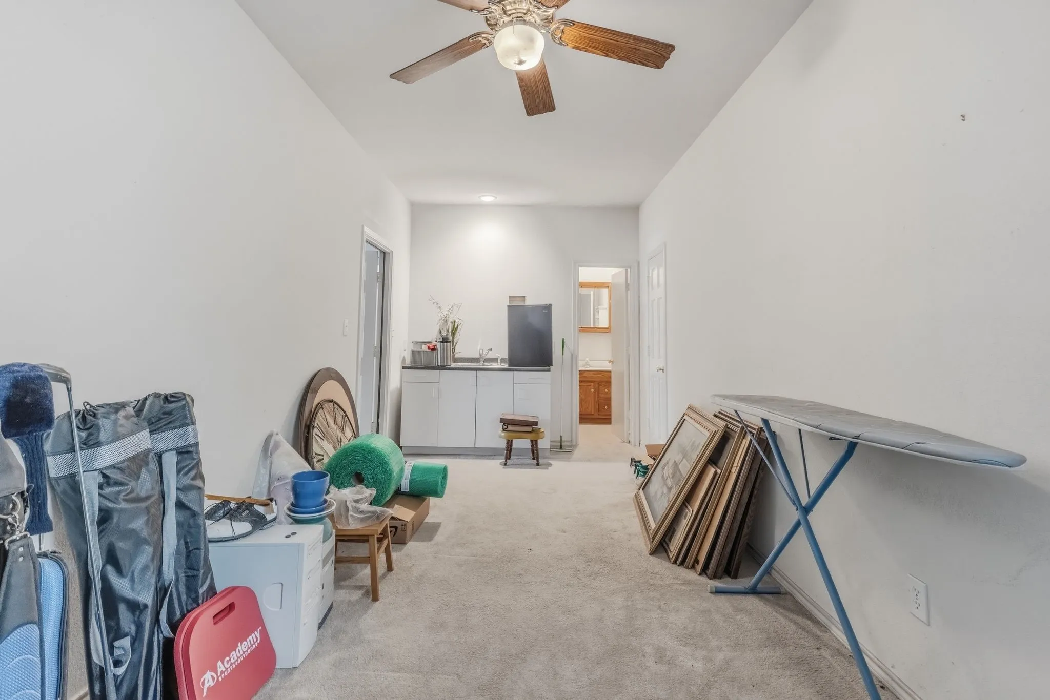 Office/study with cabinet and sink with shower bath connected