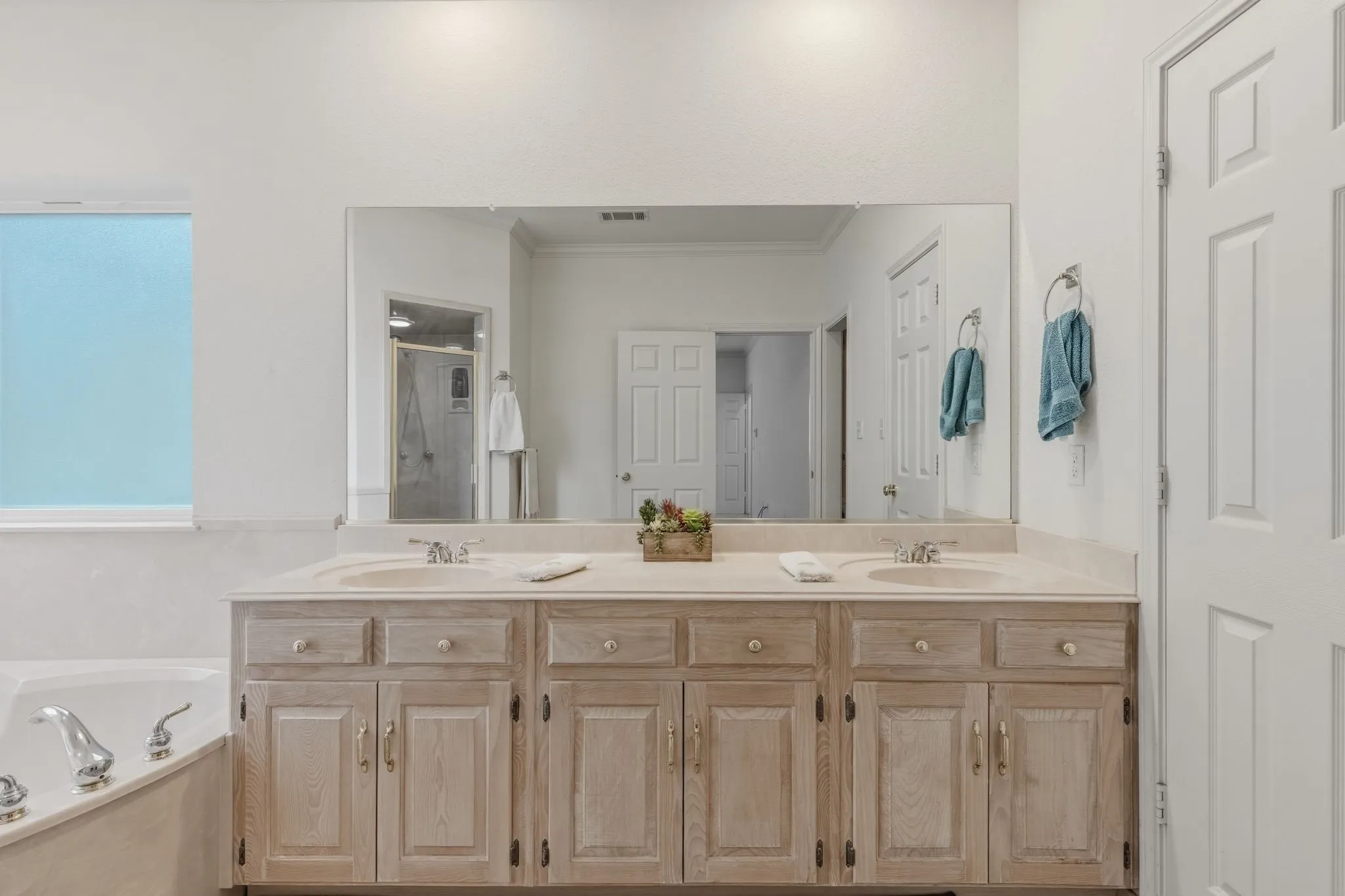 Spacious primary bathroom with walk in closet