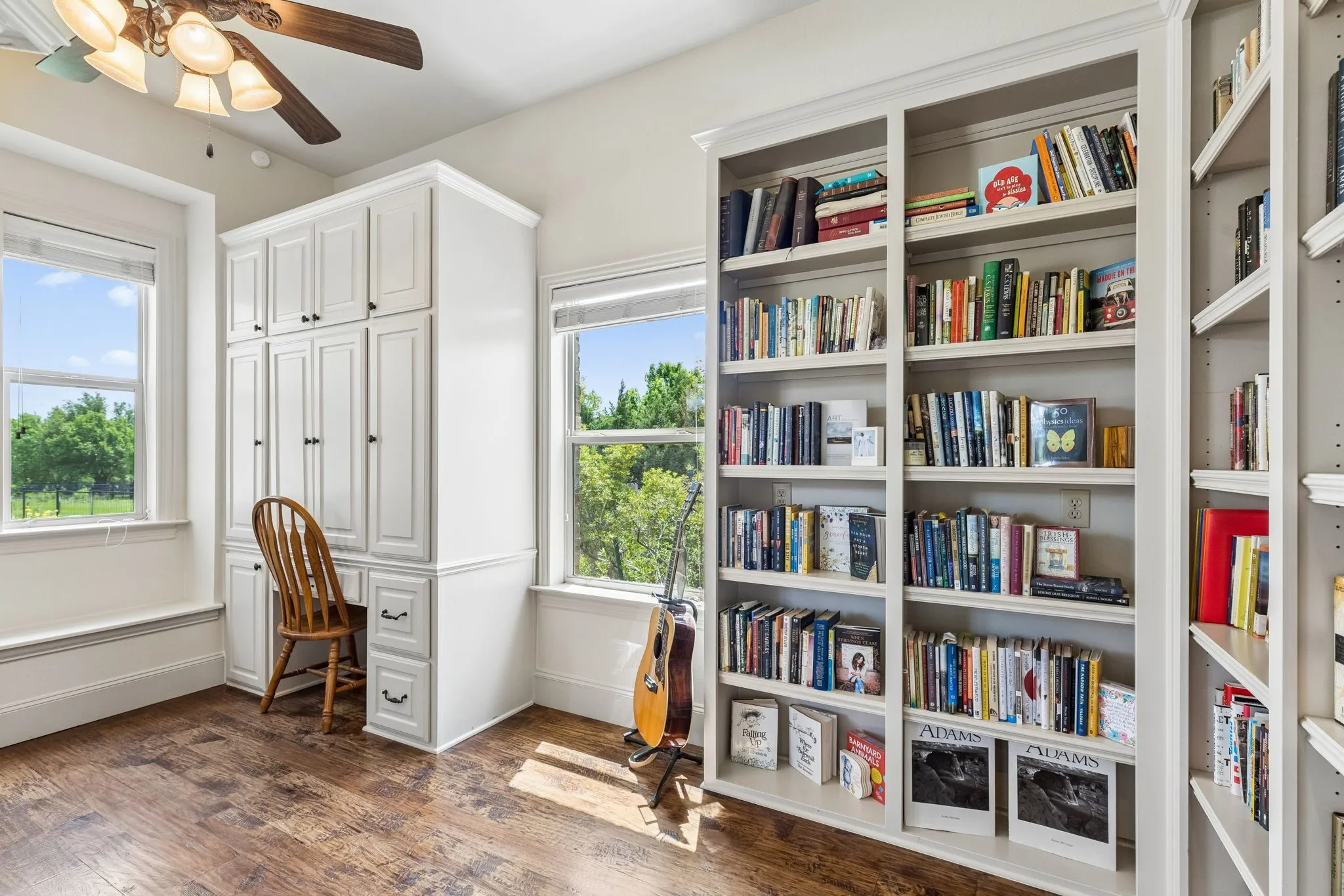 This desk area with cabinetry is right off of the Primary Bedroom a great library niche