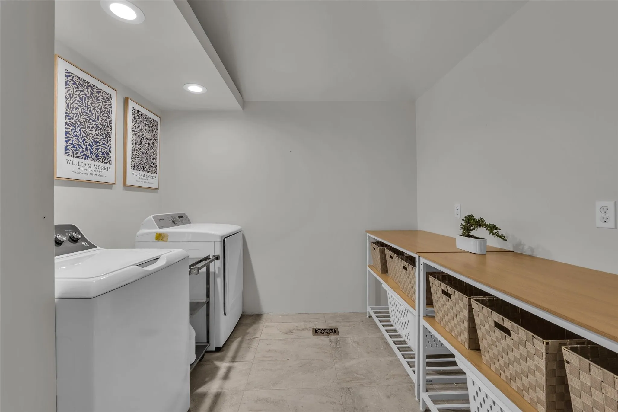 Laundry area featuring independent washer and dryer and recessed lighting