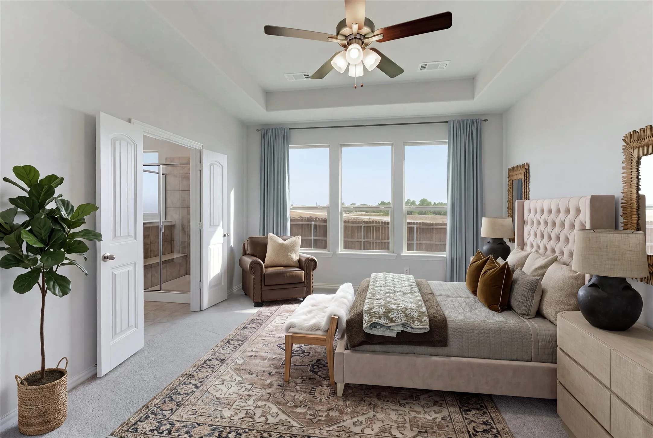 Tray ceiling with a ceiling fan, carpeted flooring, and a multiple-pane window