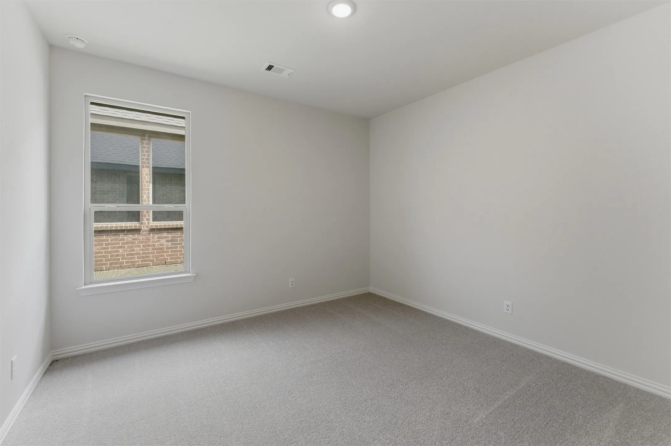 Neutral tone walls and carpeting create a versatile interior space