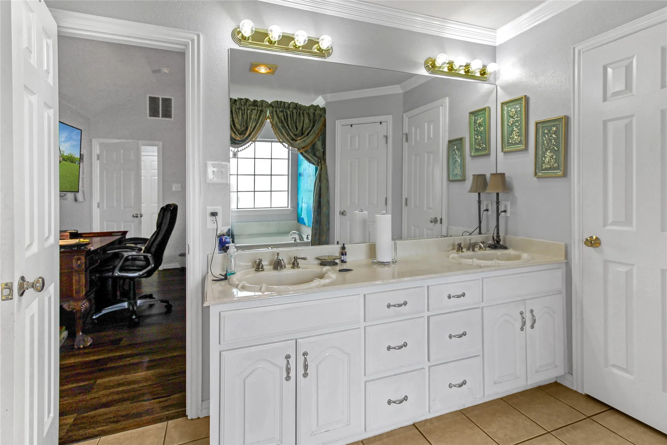 Double vanity with white cabinetry and integrated sinks