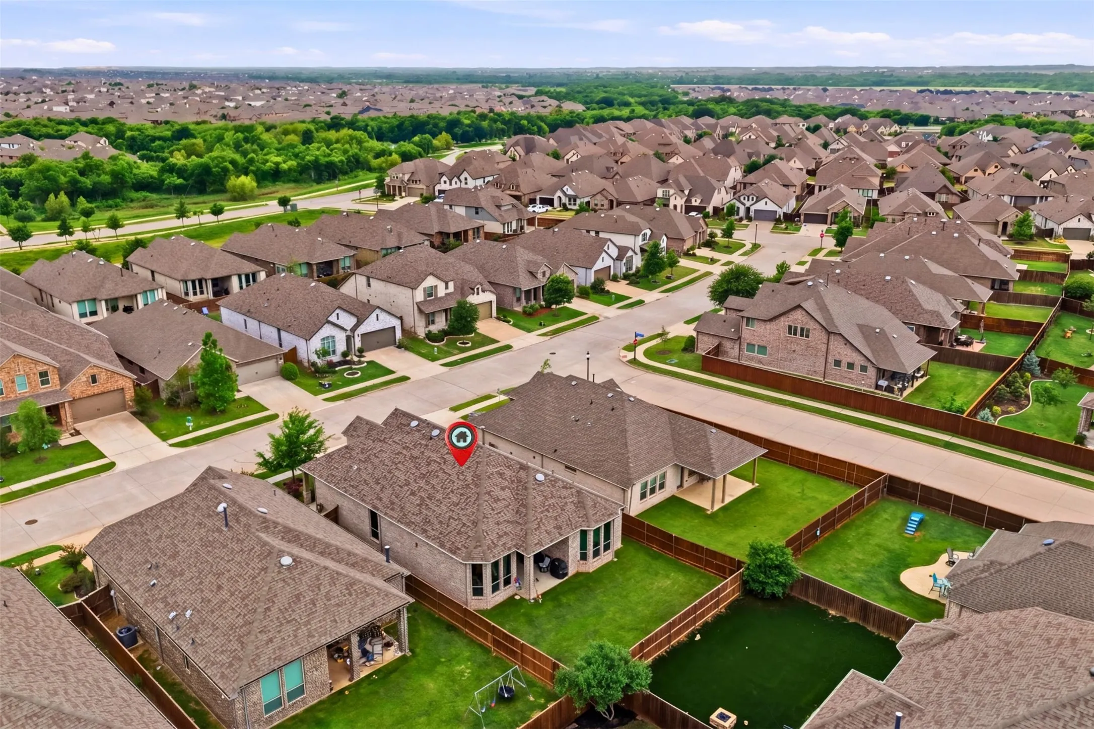 The property is situated in a neighborhood with numerous residential homes, each featuring individual yards