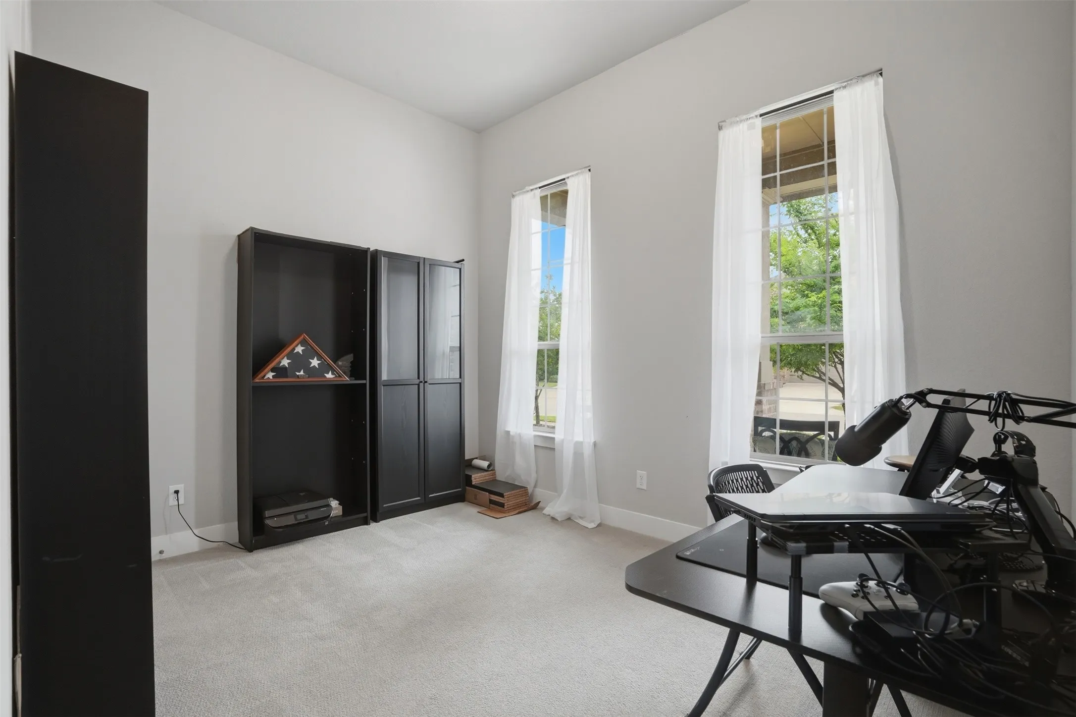 Bedroom #1 offers an abundance of natural light and large windows