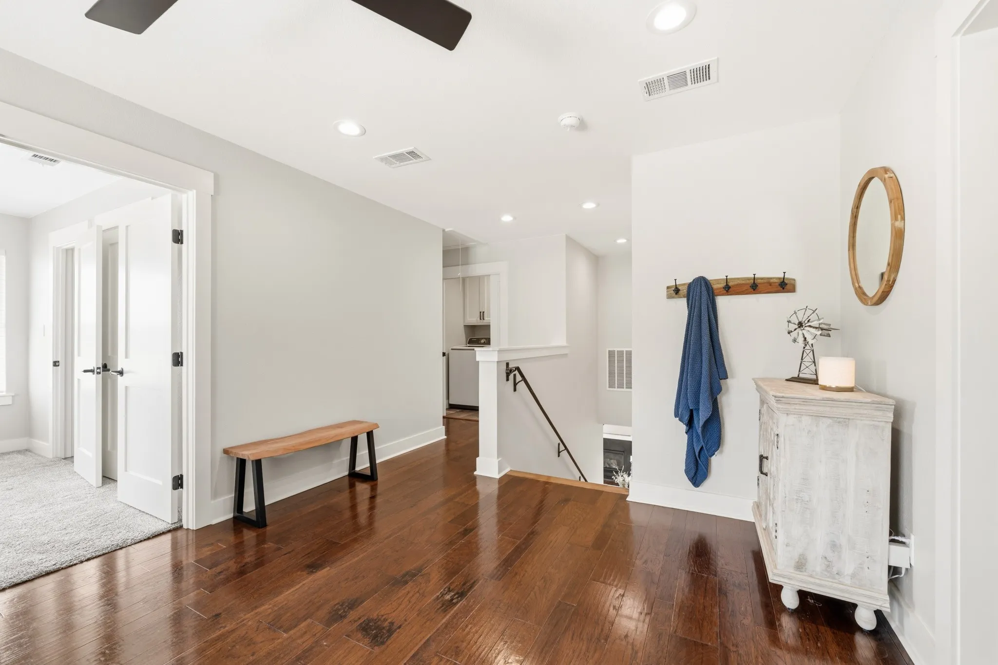 This property features rich hardwood flooring, recessed lighting, and a modern ceiling fan