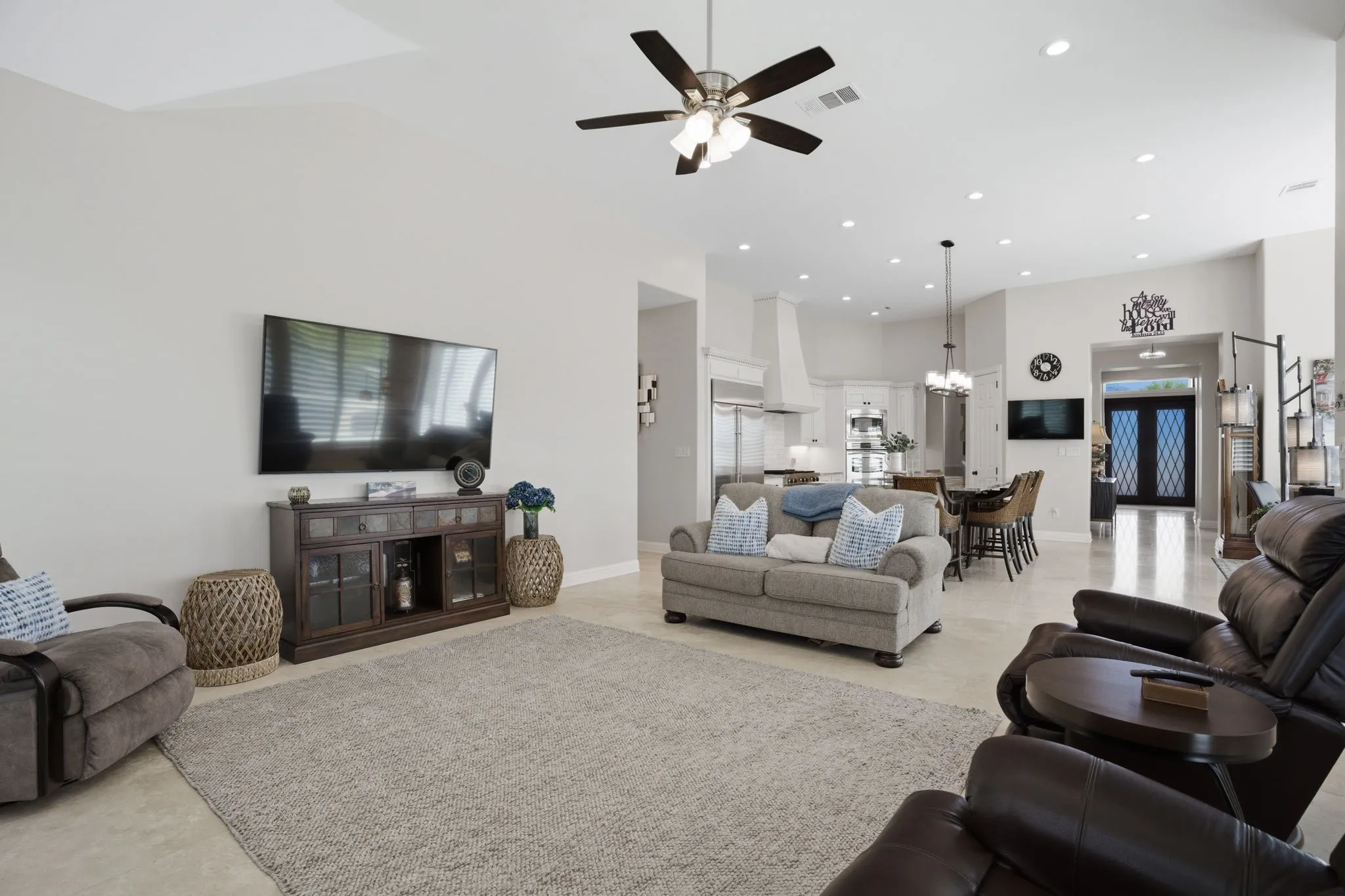 Neutral tone walls + elegant Travertine floors add warmth & timeless appeal while being durable & easy to maintain.