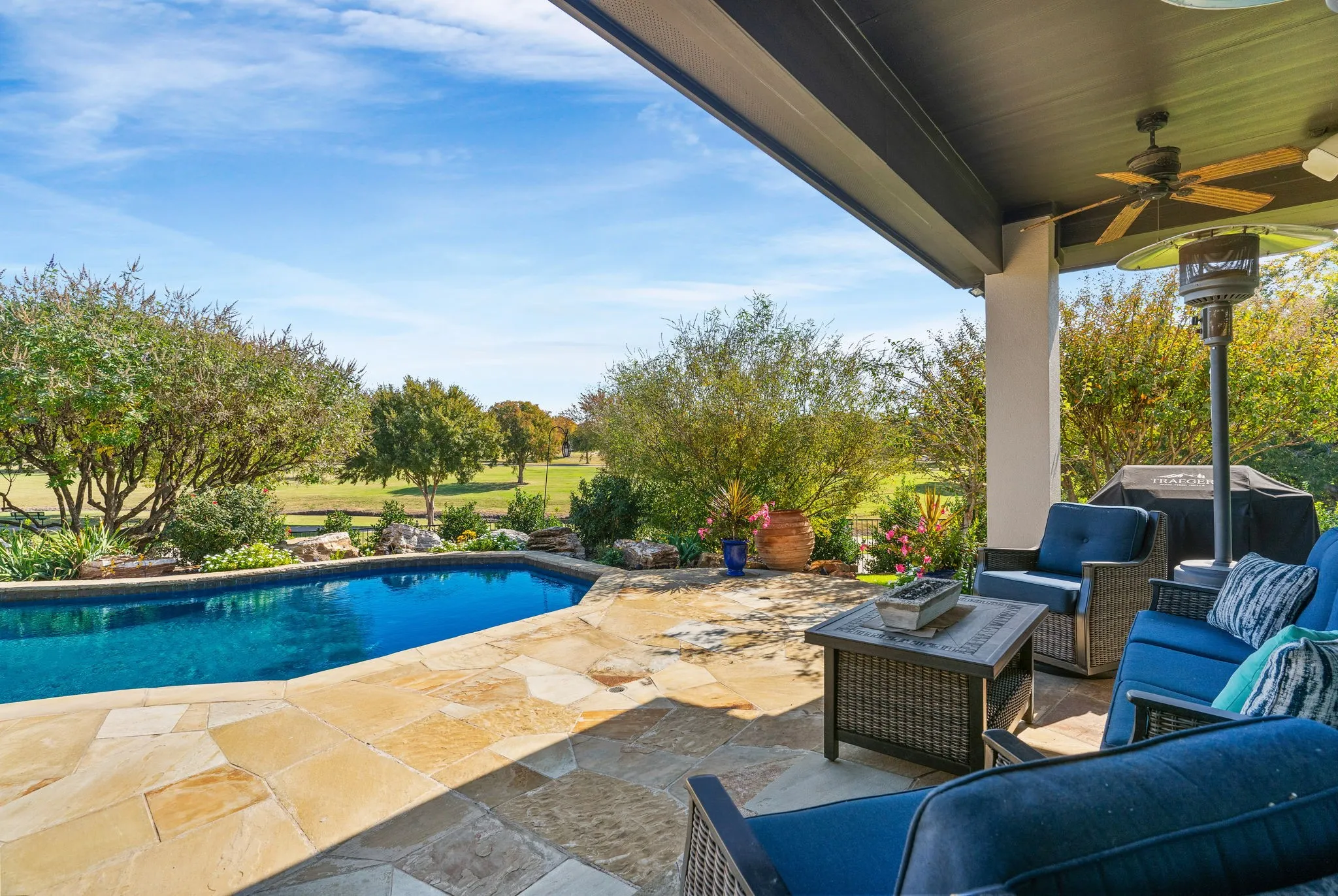 As you step outside to your private backyard retreat, you'll appreciate afternoon shade in the heat of Texas summers + appreciate the panoramic views of the community greenspace beyond.