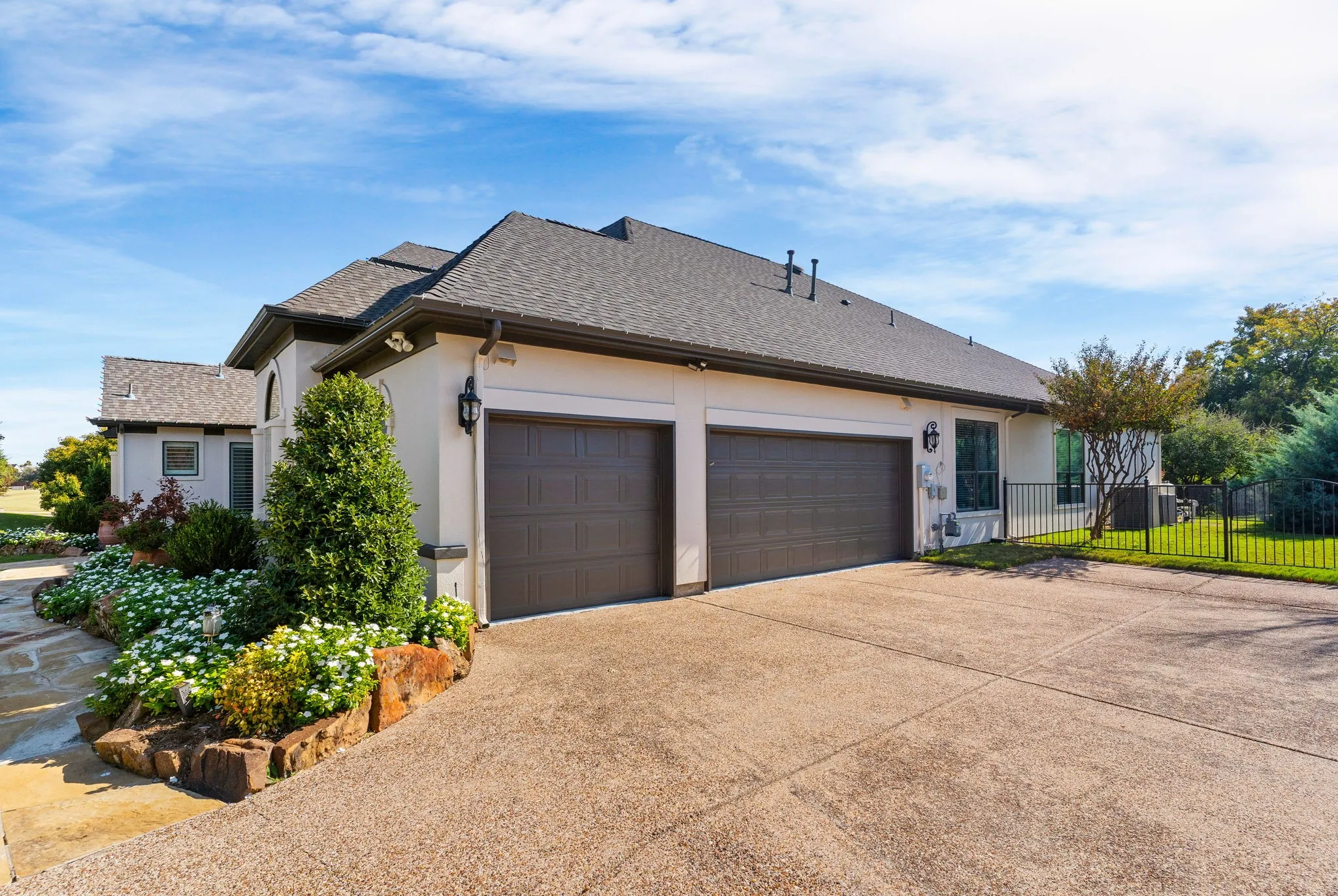 Oversized 3-car garage compliments the wide driveway for additional parking ~ for yourself &/or guests.