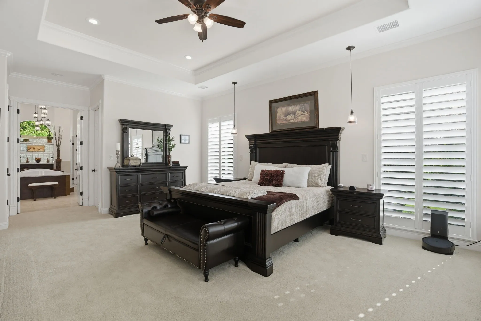 A seller favorite ~ this oversized primary bedroom is a true retreat! Large windows & double doors fill the space with natural light, creating a peaceful connection to the outdoor setting.