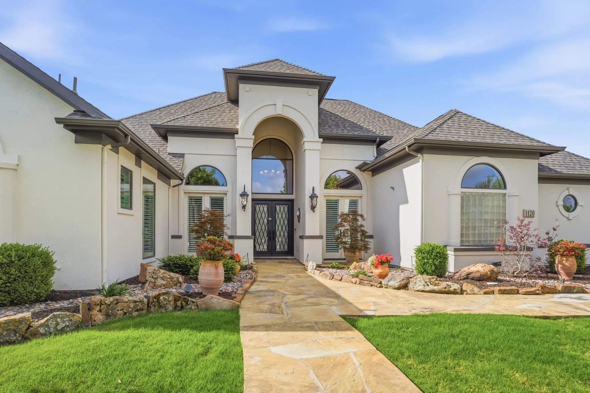 From the moment you arrive, this Twin Oaks home's curb appeal makes a lasting impression.  A grand set of double wrought iron front doors serve as the focal point, combining timeless craftsmanship with an inviting sense of arrival. Come on in!
