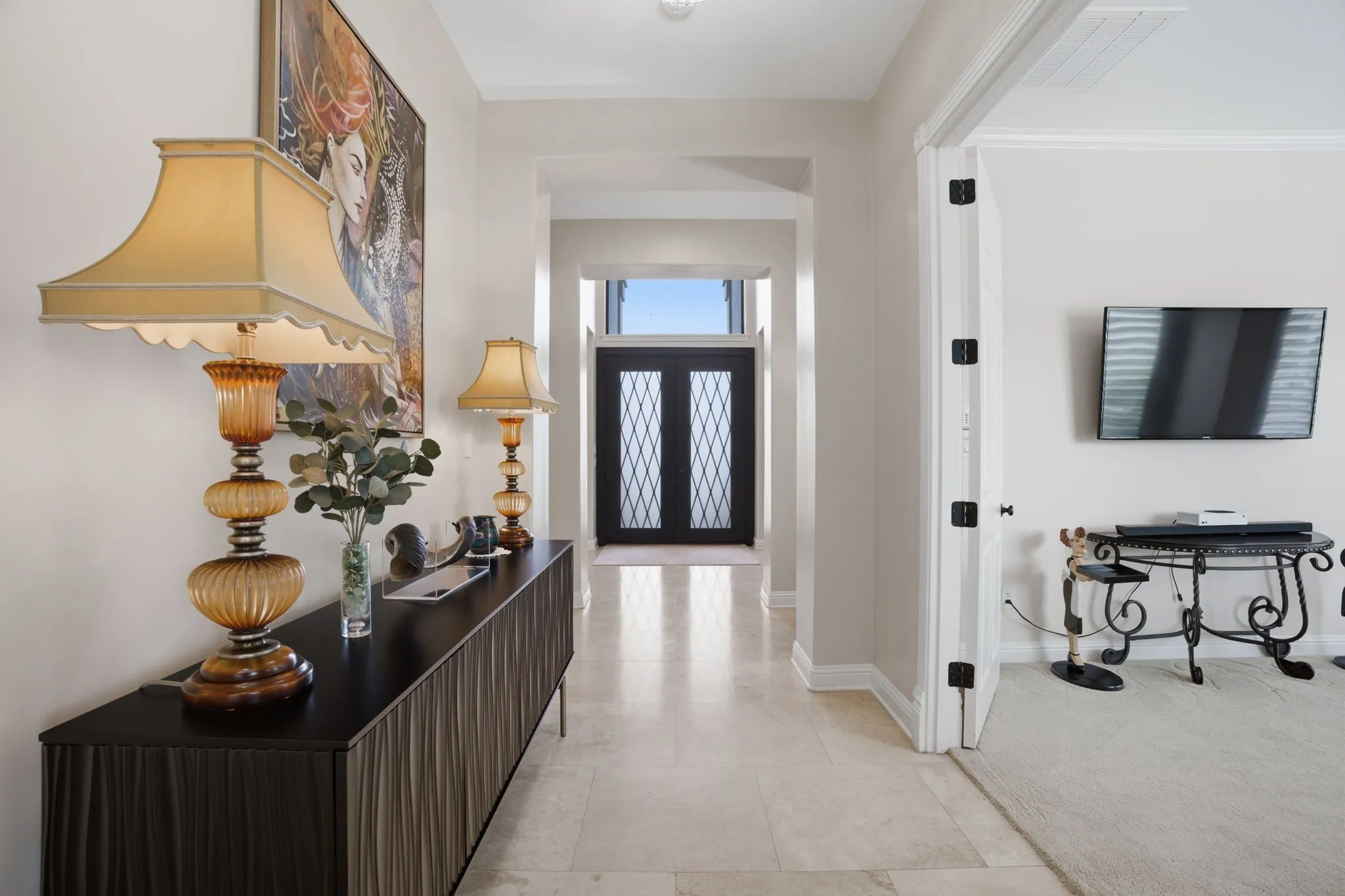 High-end Travertine floors & elevated ceilings in the foyer create a sense of openness & sophistication, while thoughtfully curated upgrades reflect the level of detail today's luxury buyers expect. Over $180k in recent updates/upgrades.