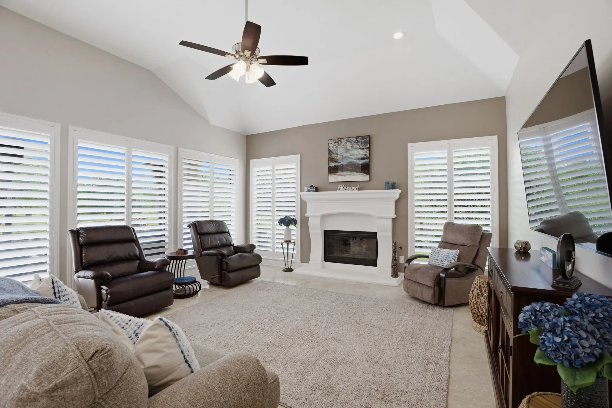 Everyone loves a comfortable, expansive family room ~ large enough for many furniture placement options for the family & friends to gather. Its focal point is the stone-encased gas log fireplace.