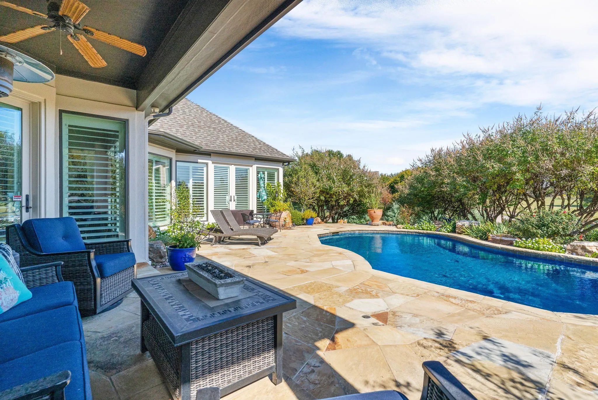 The sellers' pride of ownership is evident in the meticulously maintained landscaping that surrounds the swimming pool. From vibrant, well-established plantings to the mature trees, this attention to detail is a genuine investment in preserving the outdoor space as a true highlight of the home.
