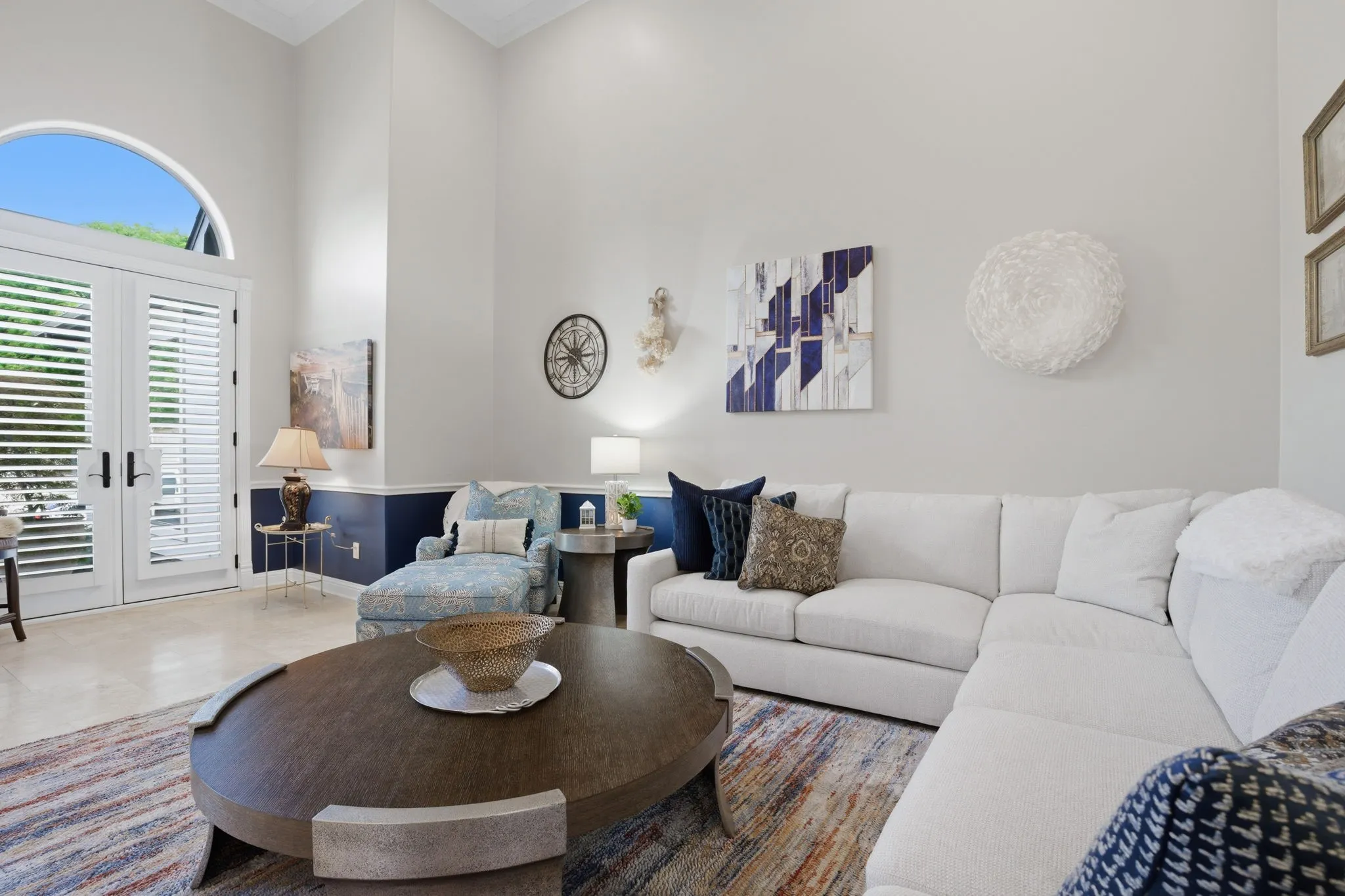 High ceilings, fresh paint & another set of French doors .... this living room offers a clean, modern aesthetic.  Large enough for an oversized sectional or conversation pit...you'll love the unlimited furniture placement options this room supports.