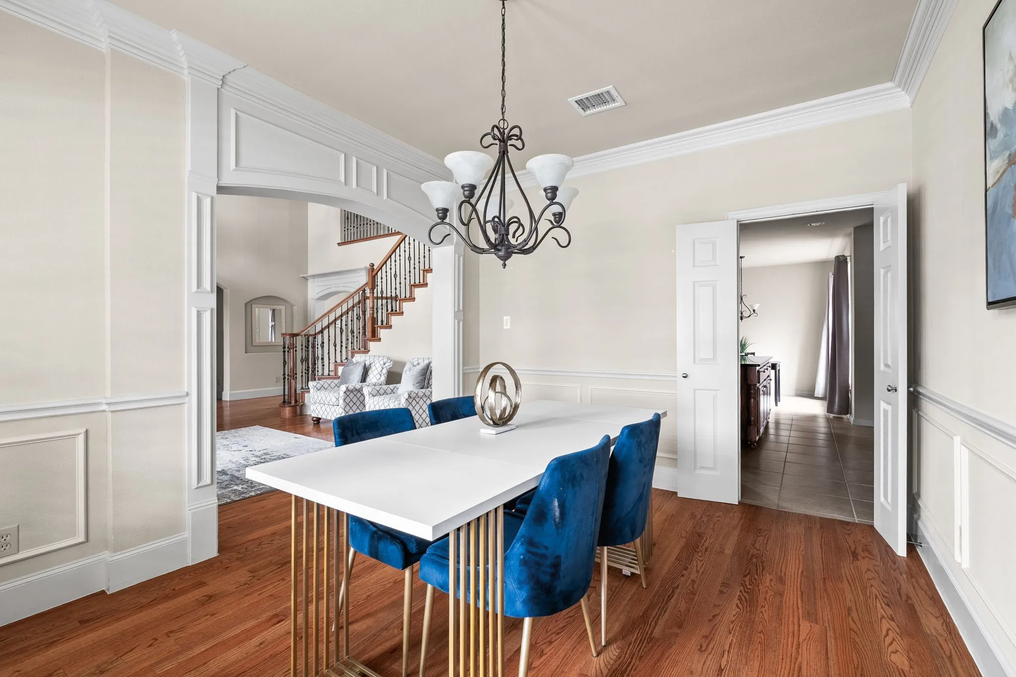 Dining room looking into kitchen on the right and formal living on the left.