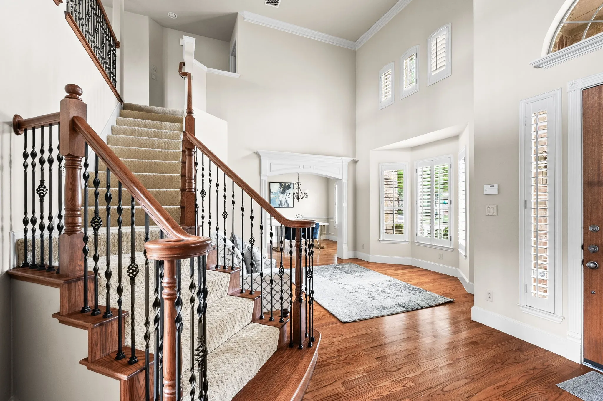 Entryway looking at formal living and dining rooms with plantation shutters