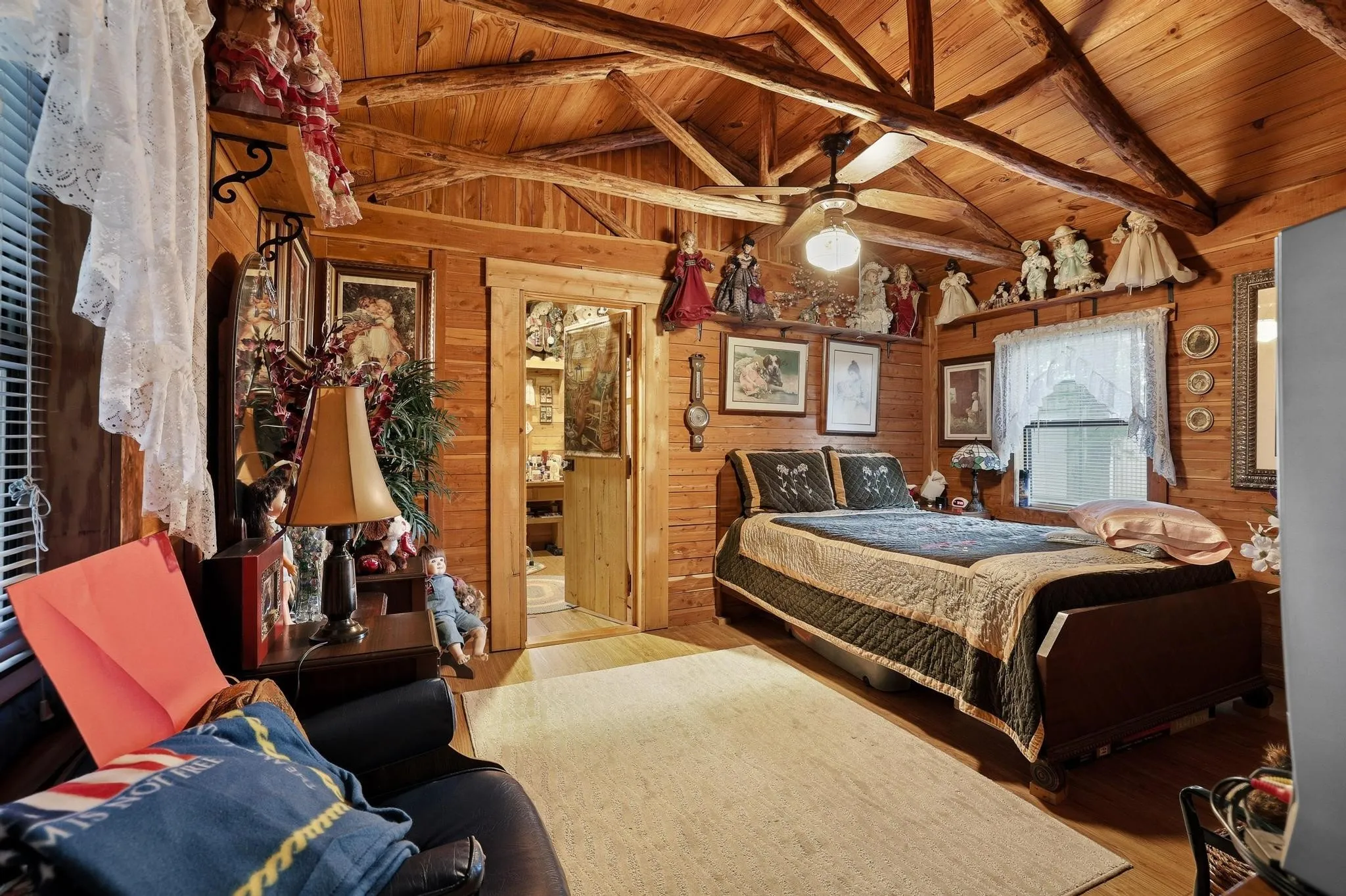 This room features natural wood paneling on the walls and ceiling, creating a rustic aesthetic