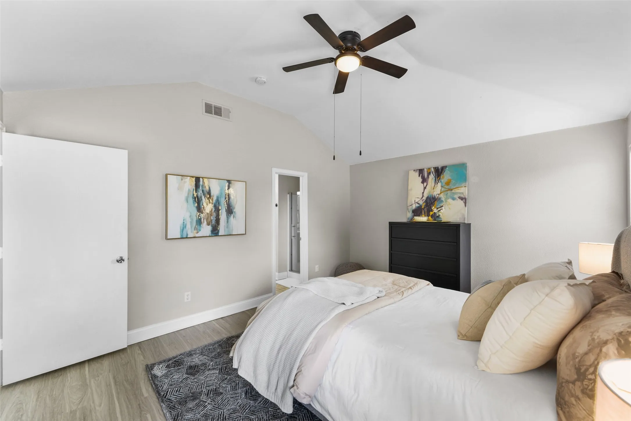 Bedroom with wood finished floors and ceiling fan