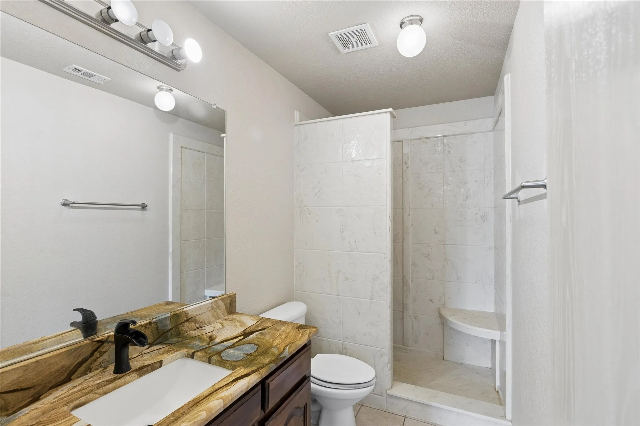 Bathroom with a walk-in shower.