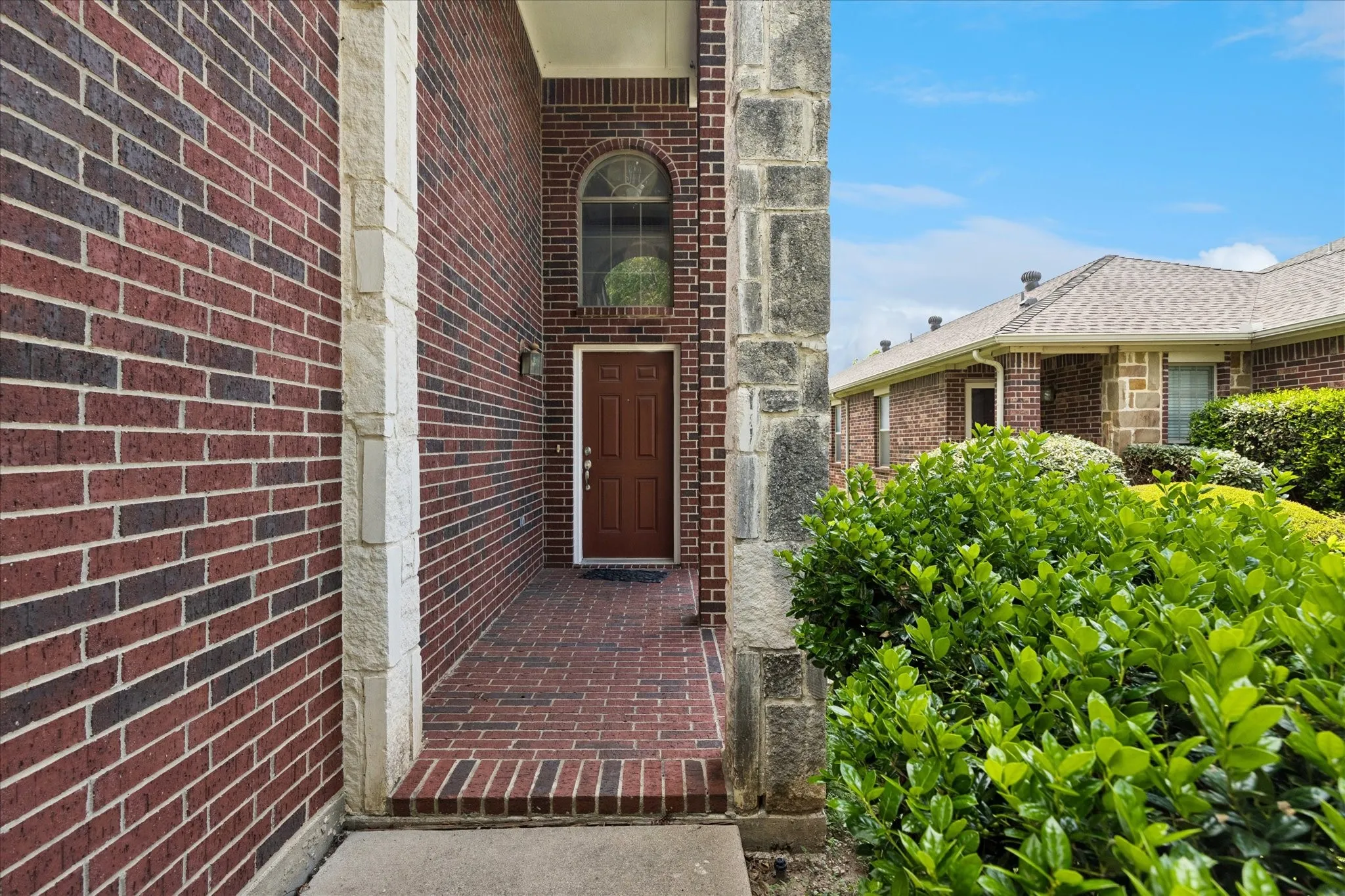 Large brick covered front porch