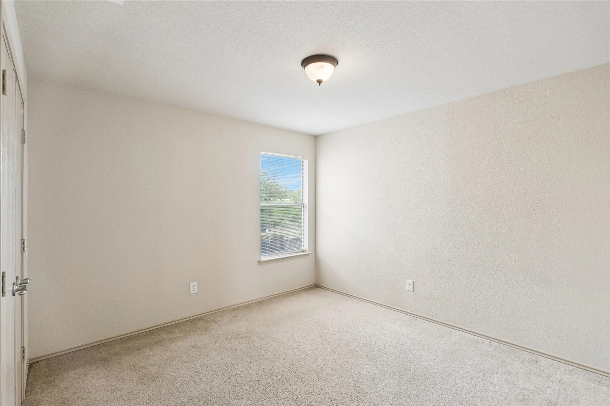 Bedroom No. 2 with double closet doors.