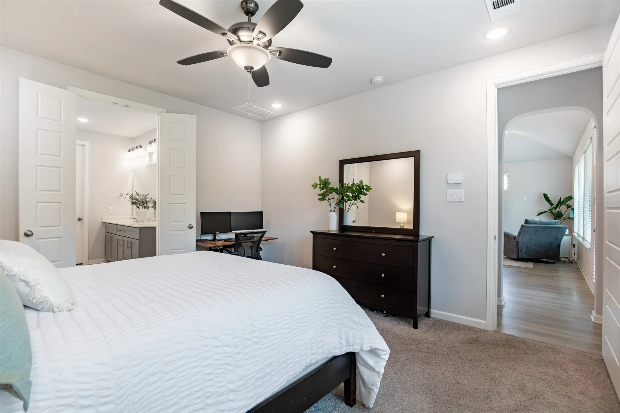 Generous primary suite privately located in the back of the home.