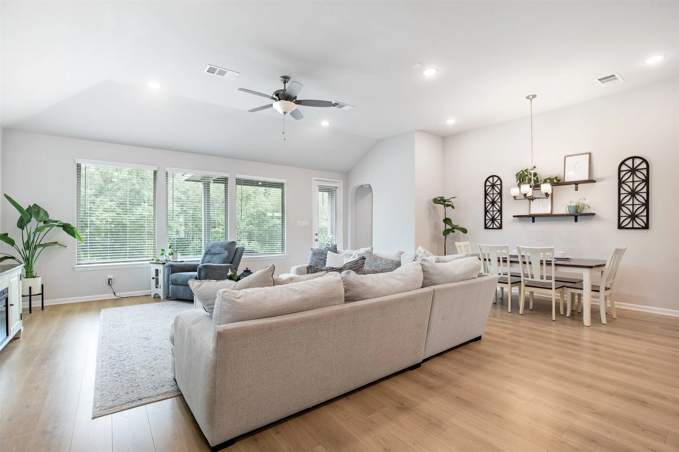 Living room overlooking the backyard and scenic green space.