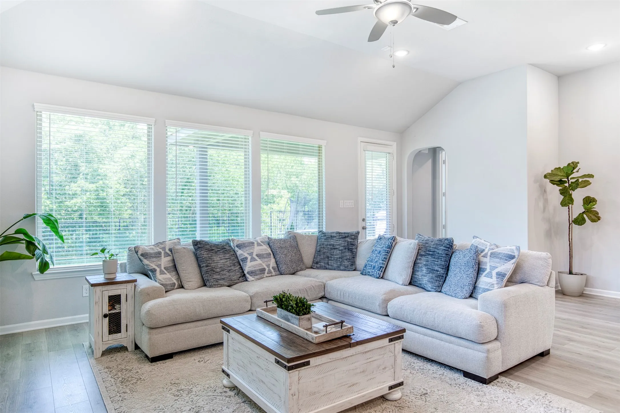 Living room with exterior door to backyard.