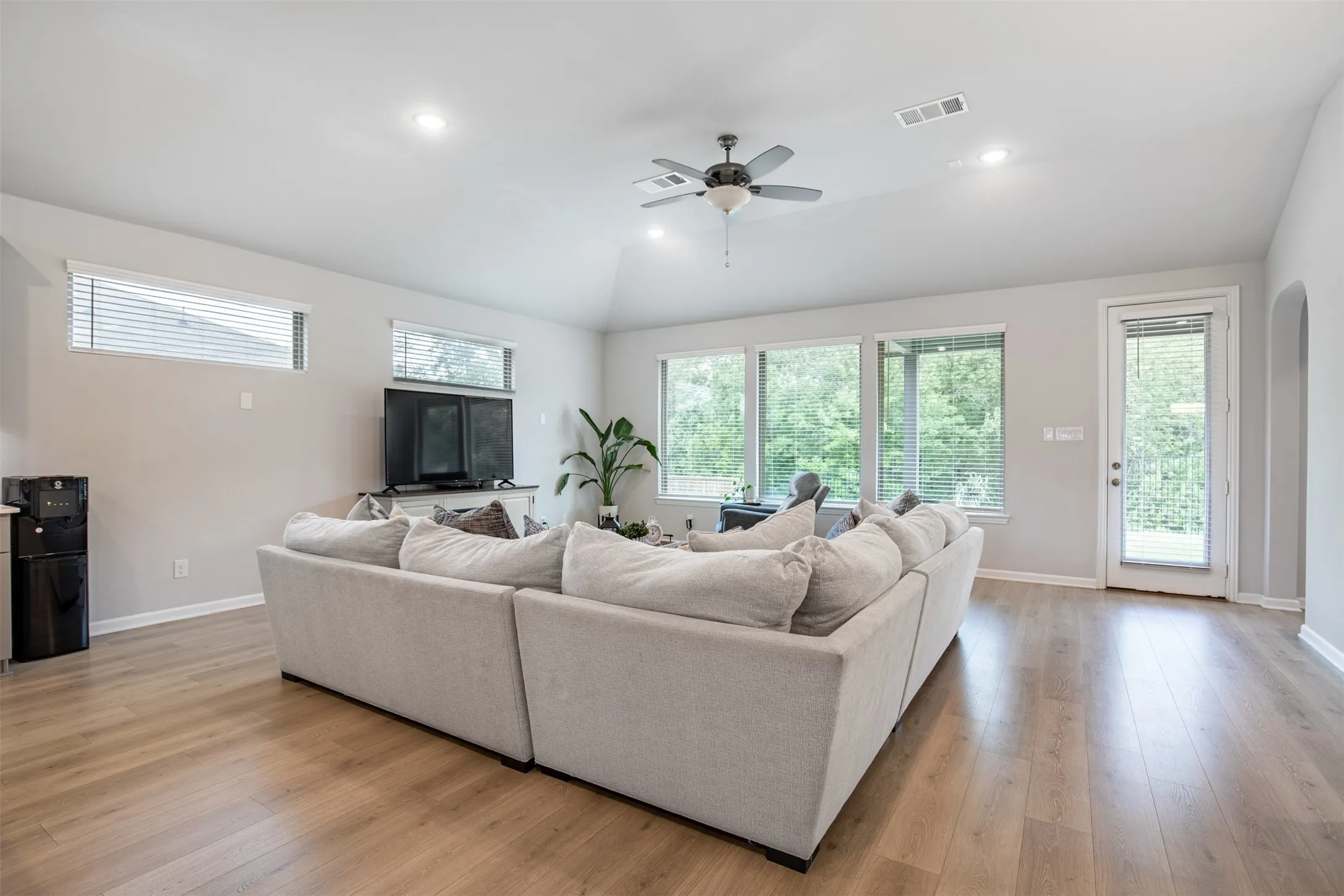 Living room with exterior door leading to patio.