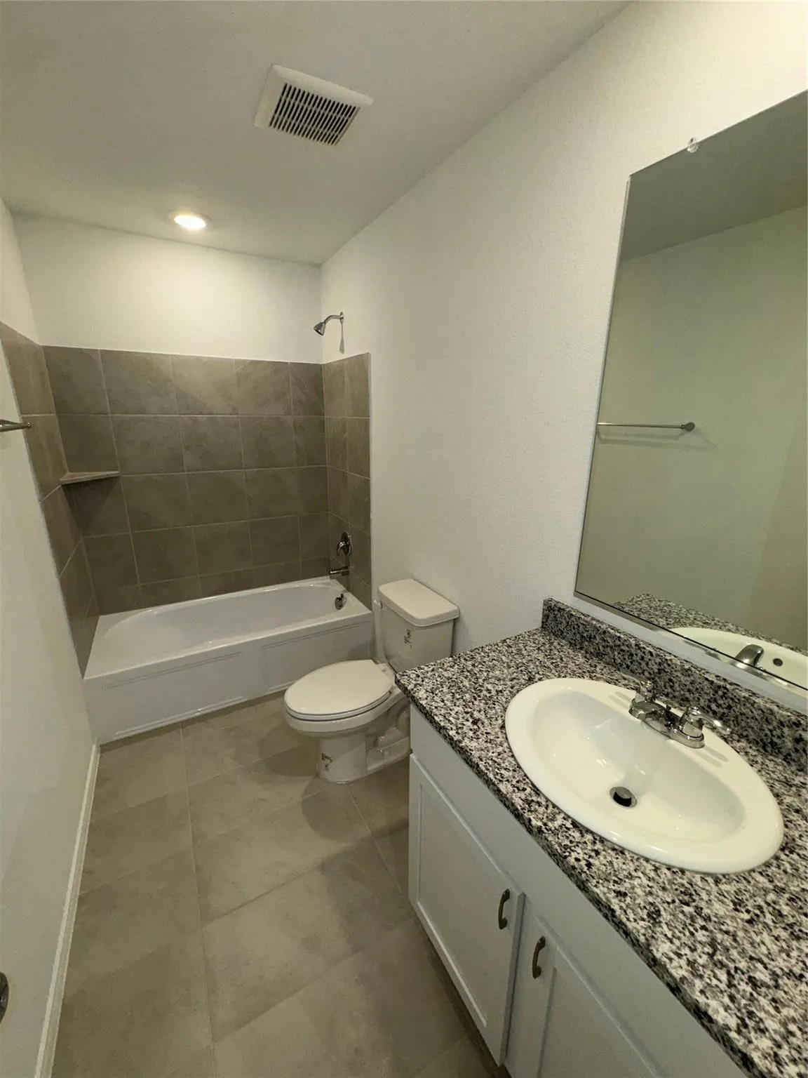 bathroom conveniently sits between secondary bedrooms