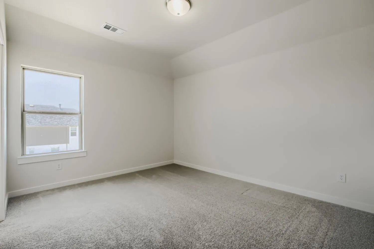 Room featuring light grey carpeting, white baseboards, and neutral wall paint