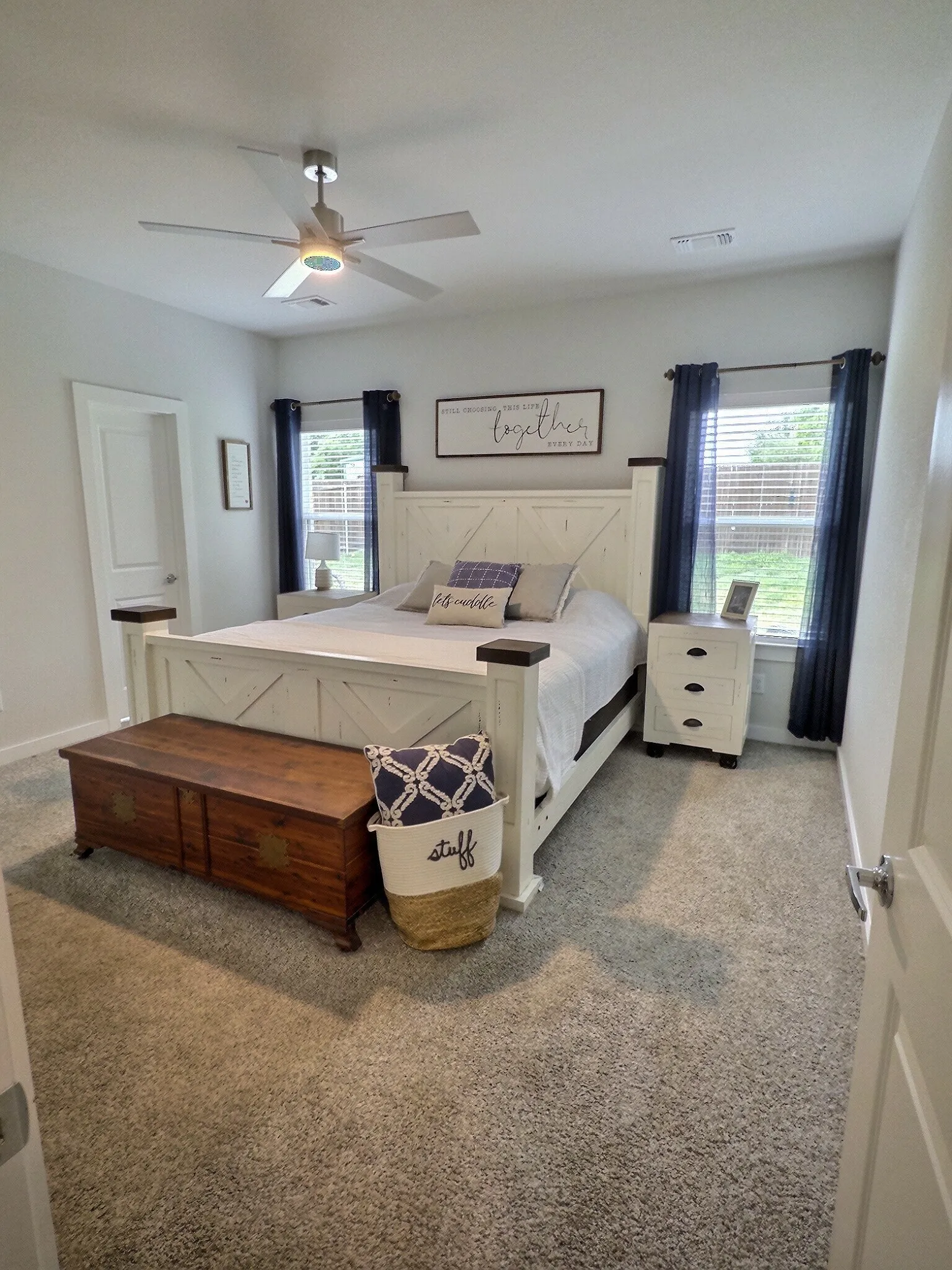 This room features light-colored walls and grey carpet flooring