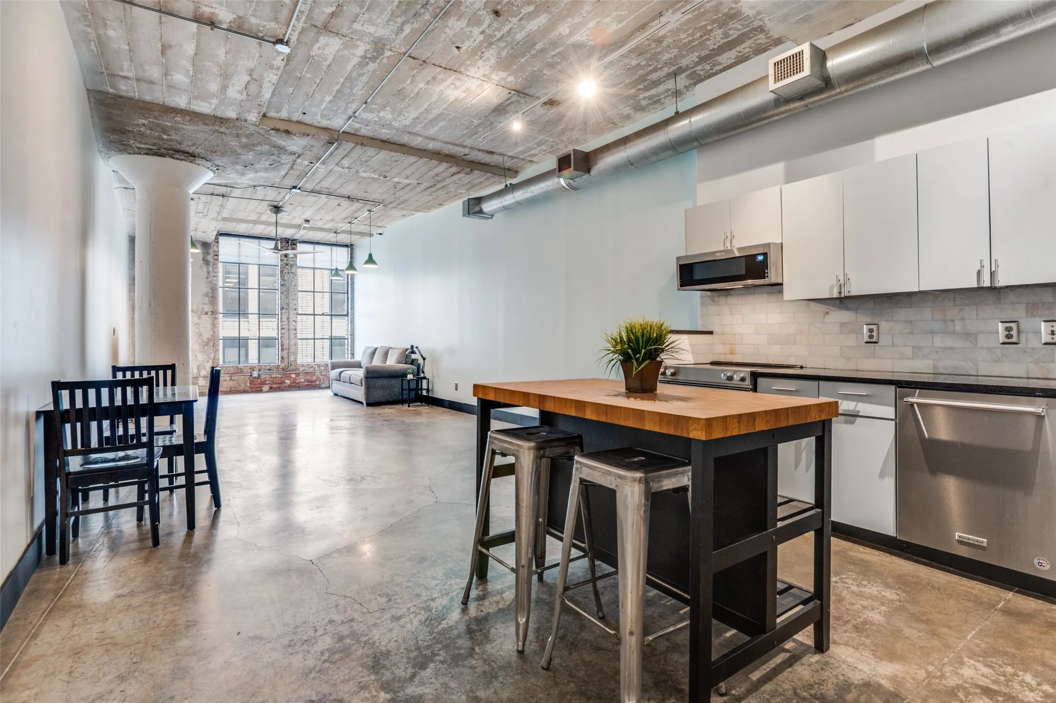 Currently this loft has minimal furniture but see the virtually staged photos for what this space could be